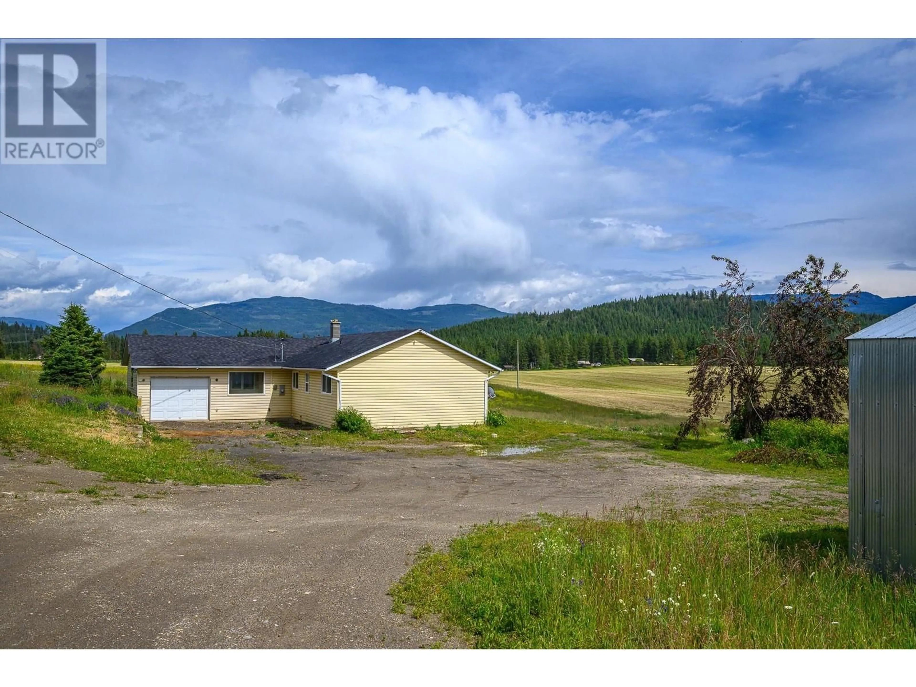 A pic from outside/outdoor area/front of a property/back of a property/a pic from drone, mountain view for 3575 CANYON ROAD, Spallumcheen British Columbia V4Y0M7