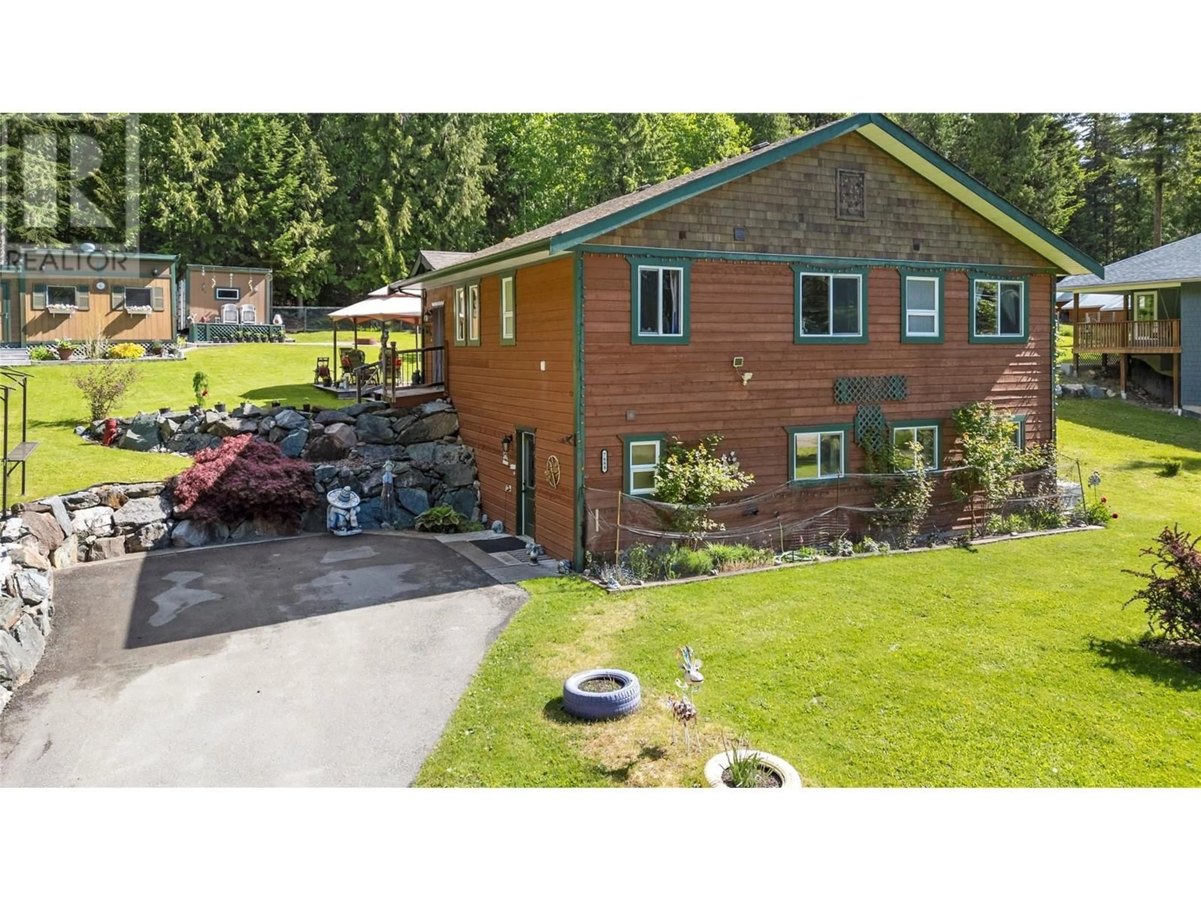 A pic from outside/outdoor area/front of a property/back of a property/a pic from drone, street for 7688 MOUNTAIN DRIVE, Anglemont British Columbia V0E1M8