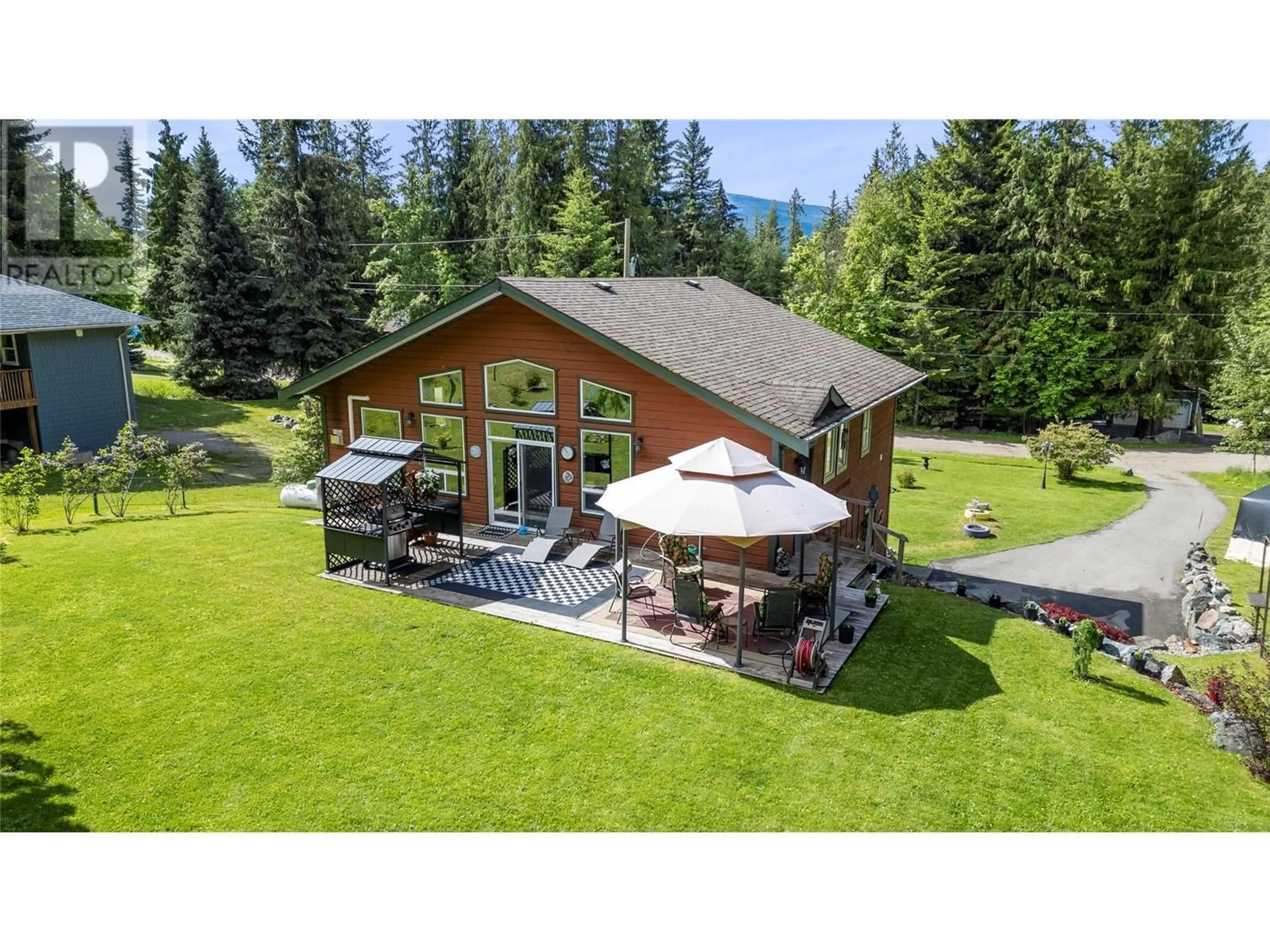 A pic from outside/outdoor area/front of a property/back of a property/a pic from drone, mountain view for 7688 MOUNTAIN DRIVE, Anglemont British Columbia V0E1M8