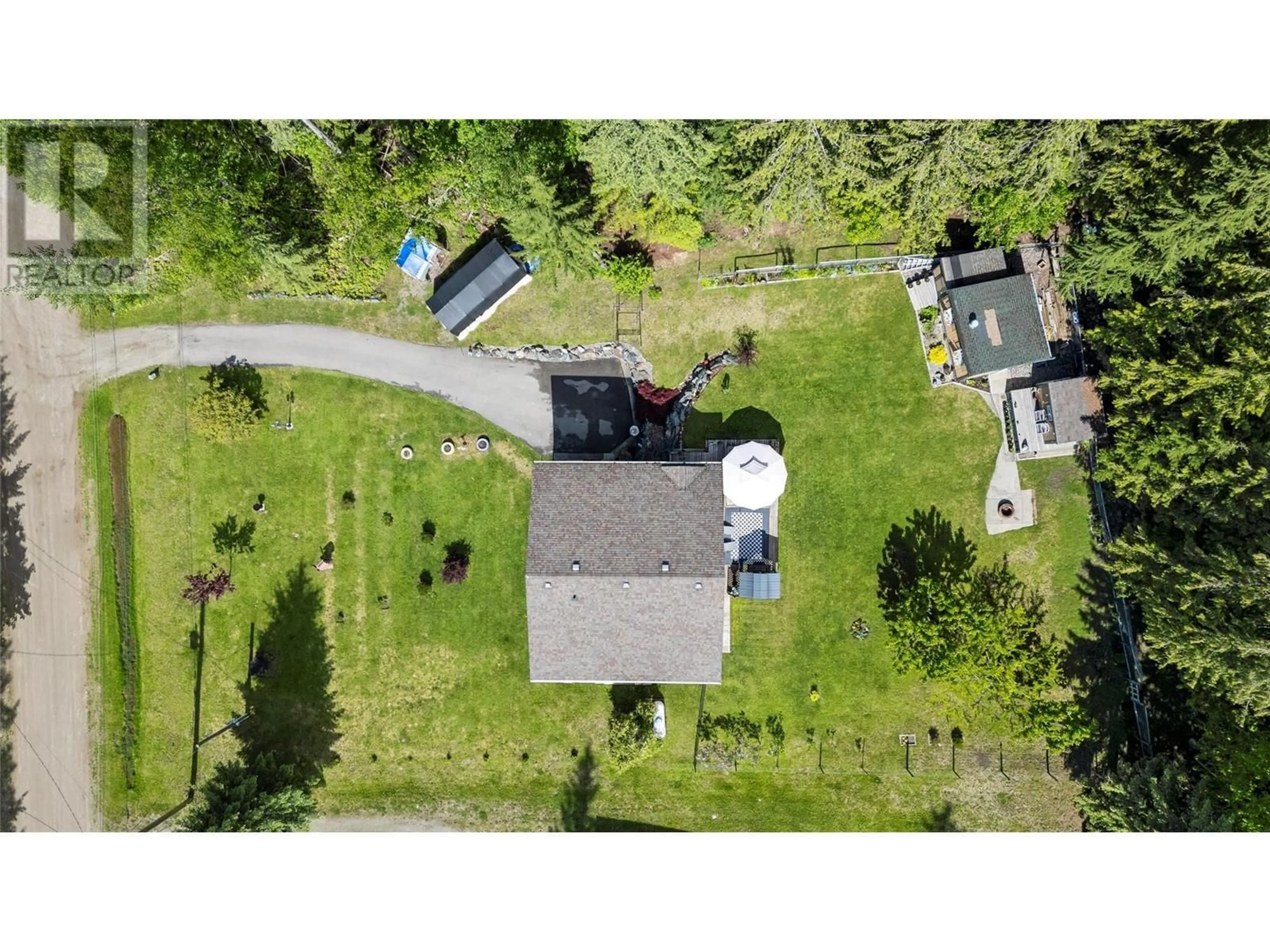 A pic from outside/outdoor area/front of a property/back of a property/a pic from drone, street for 7688 MOUNTAIN DRIVE, Anglemont British Columbia V0E1M8