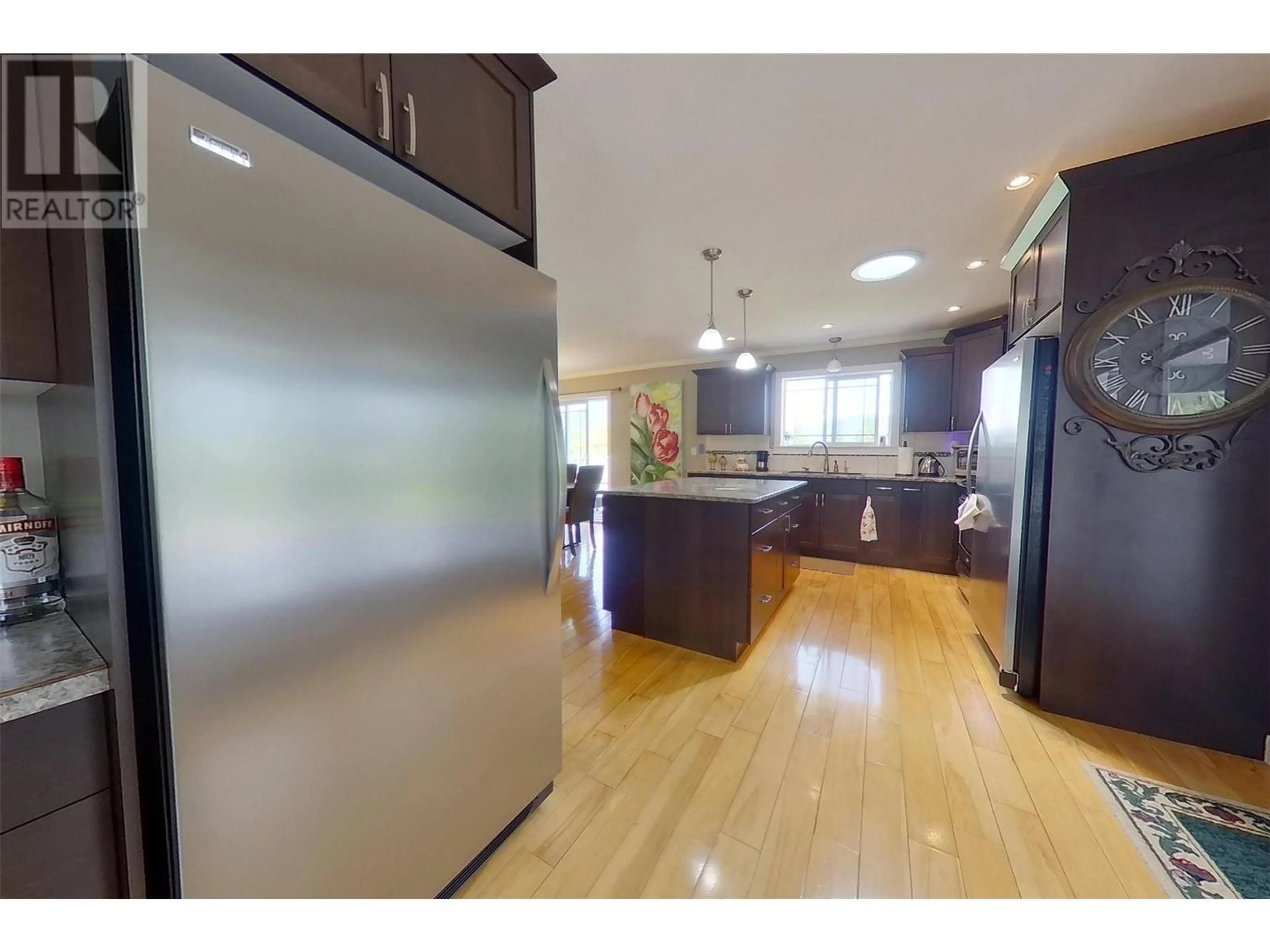 Open concept kitchen, wood/laminate floor for 3765 CRESTVIEW RD ROAD, Creston British Columbia V0B1G2