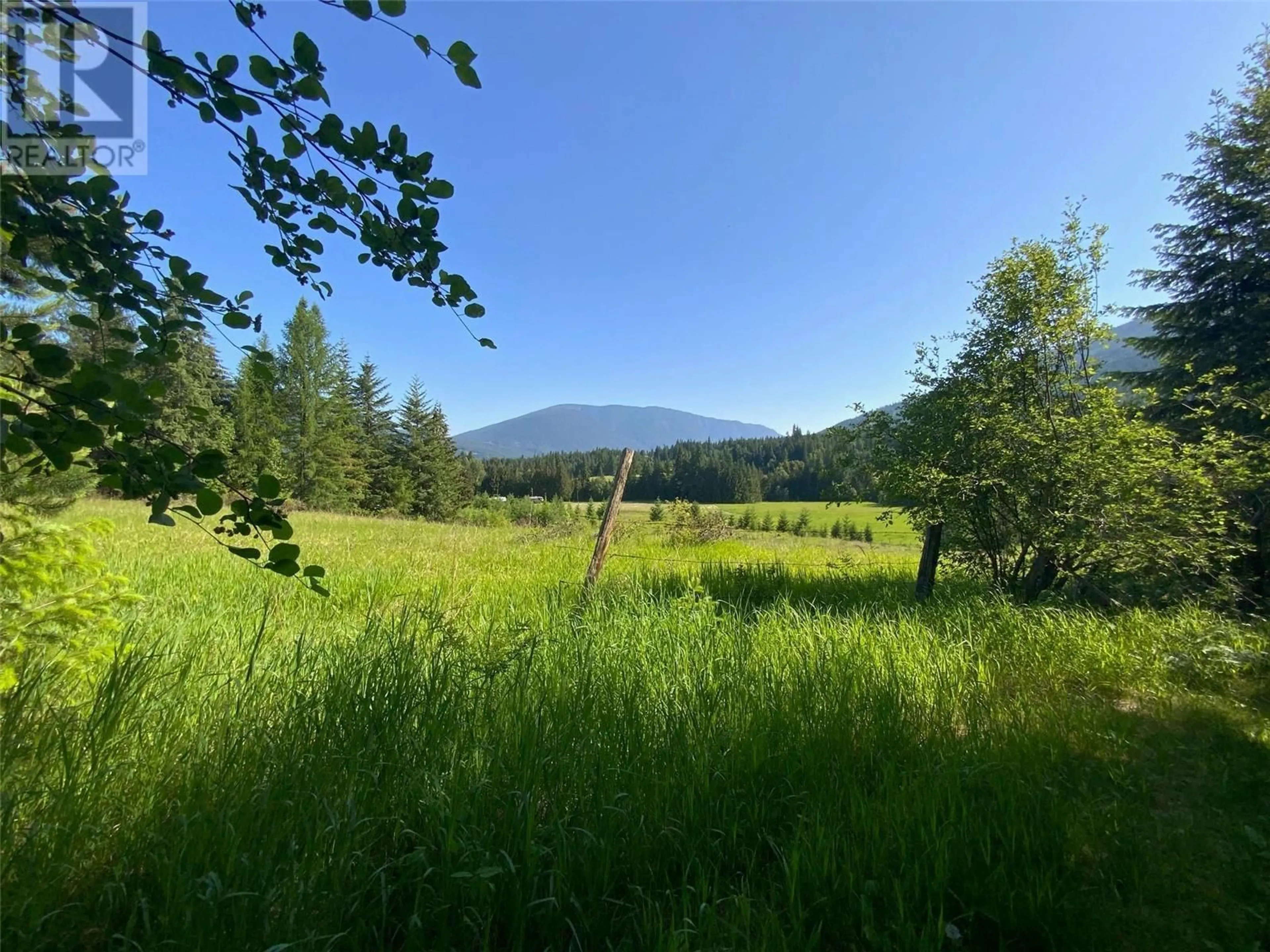 A pic from outside/outdoor area/front of a property/back of a property/a pic from drone, forest/trees view for 5090 50A STREET NORTHEAST, Salmon Arm British Columbia V1E1Y6