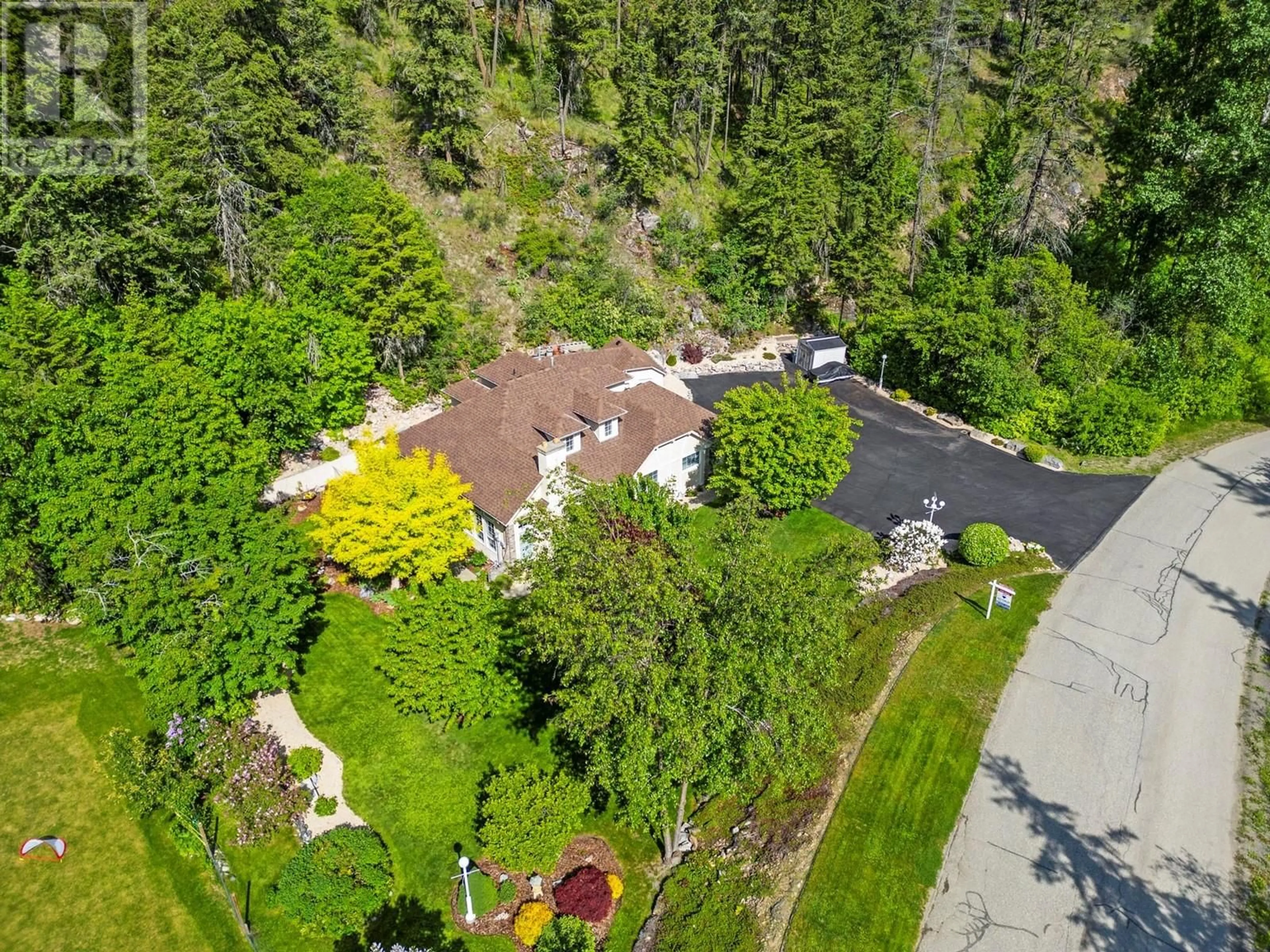A pic from outside/outdoor area/front of a property/back of a property/a pic from drone, forest/trees view for 9292 CHINOOK ROAD, Vernon British Columbia V1H1K3