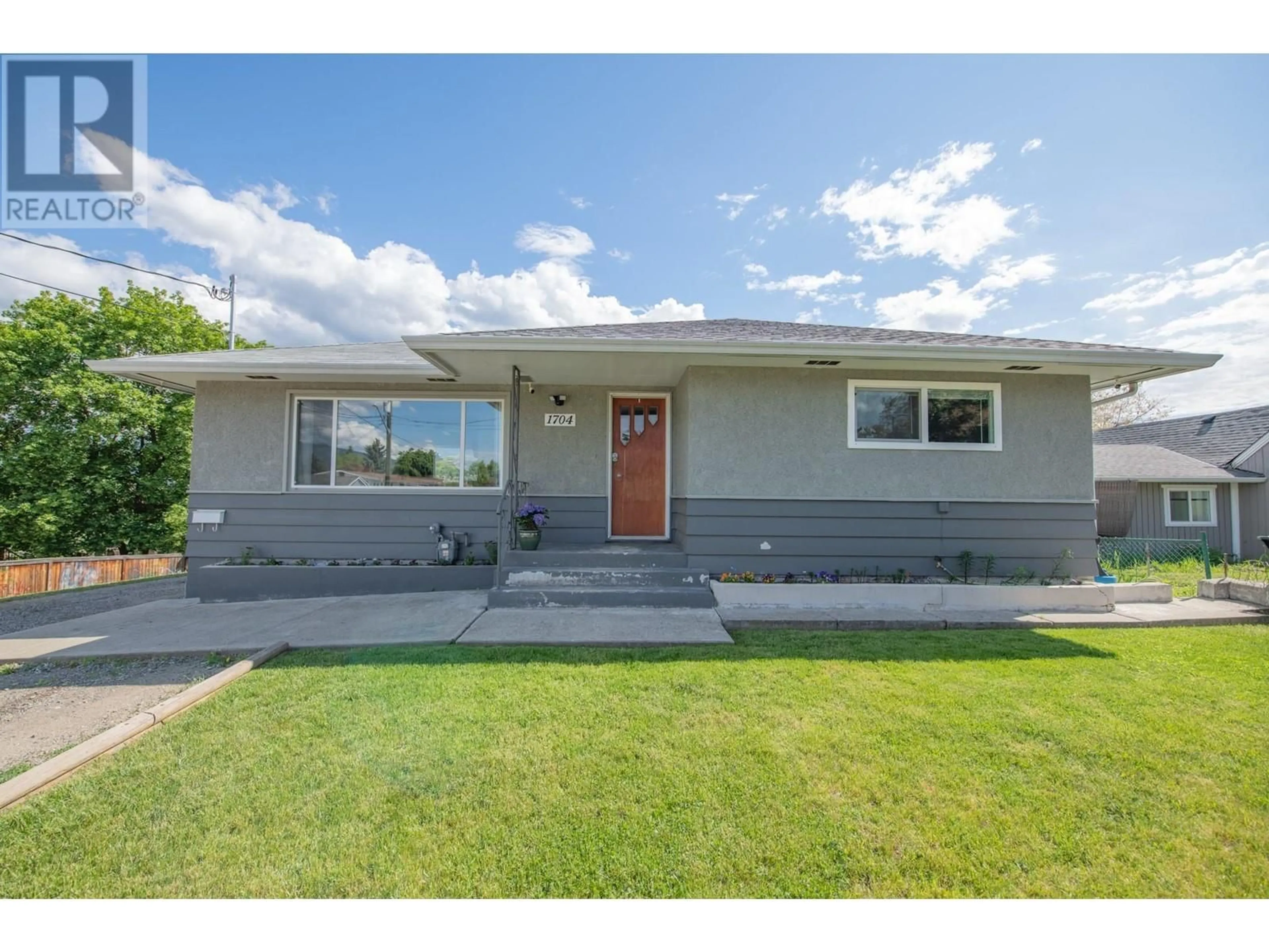 Home with vinyl exterior material, street for 1704 25 AVENUE, Vernon British Columbia V1T1M7