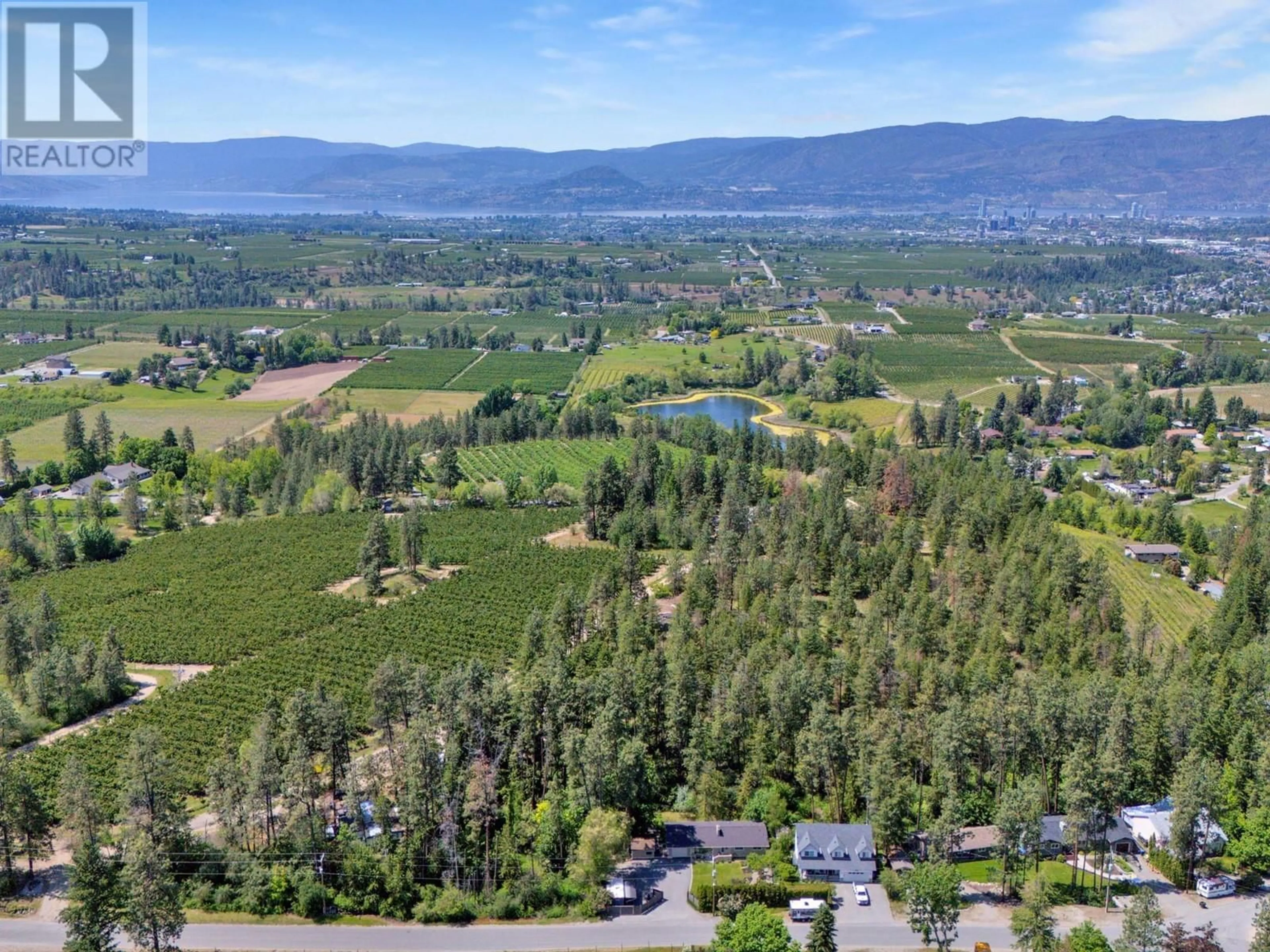 A pic from outside/outdoor area/front of a property/back of a property/a pic from drone, mountain view for 1766 GARNER ROAD, Kelowna British Columbia V1P1E5