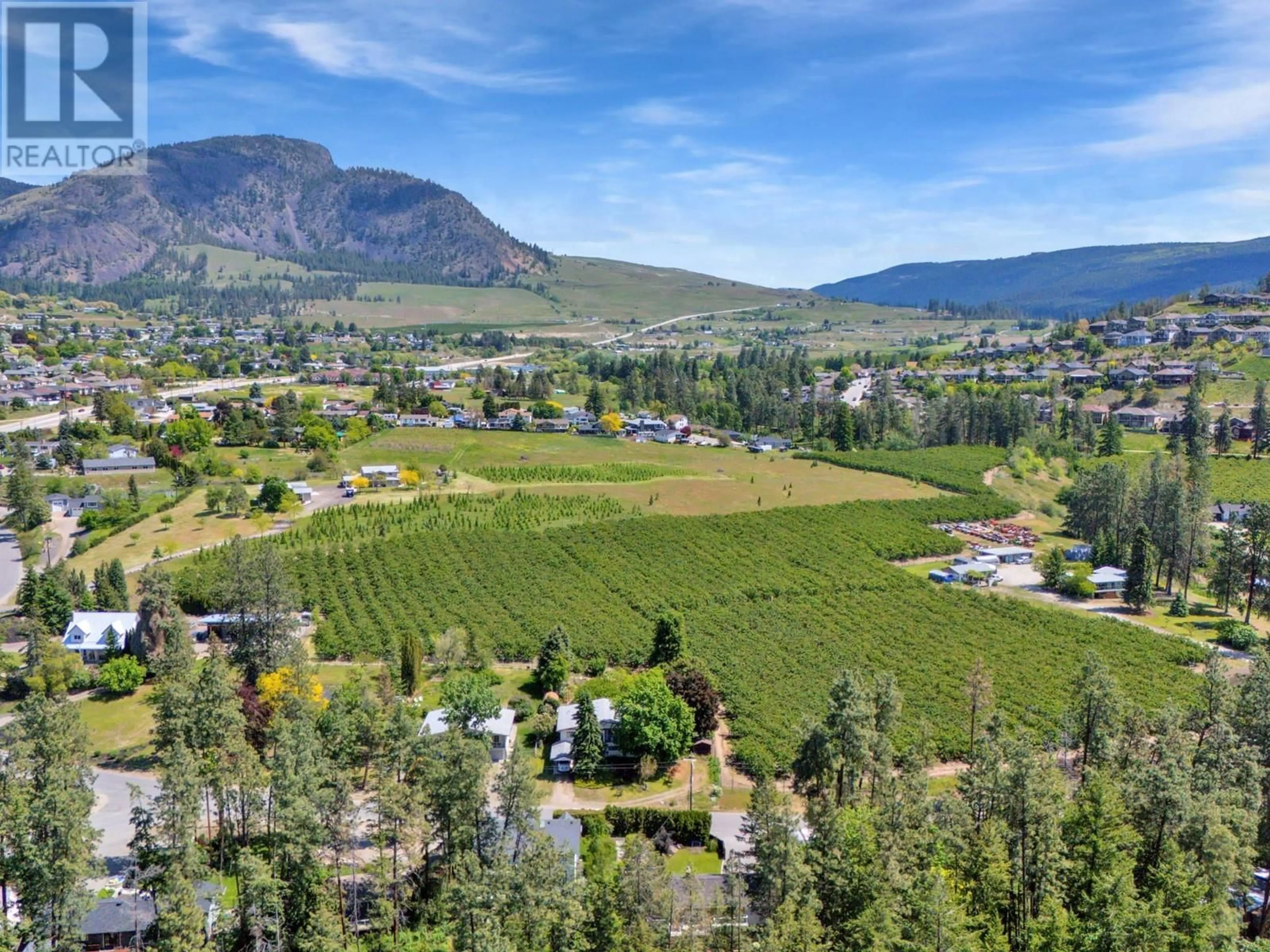 A pic from outside/outdoor area/front of a property/back of a property/a pic from drone, mountain view for 1766 GARNER ROAD, Kelowna British Columbia V1P1E5