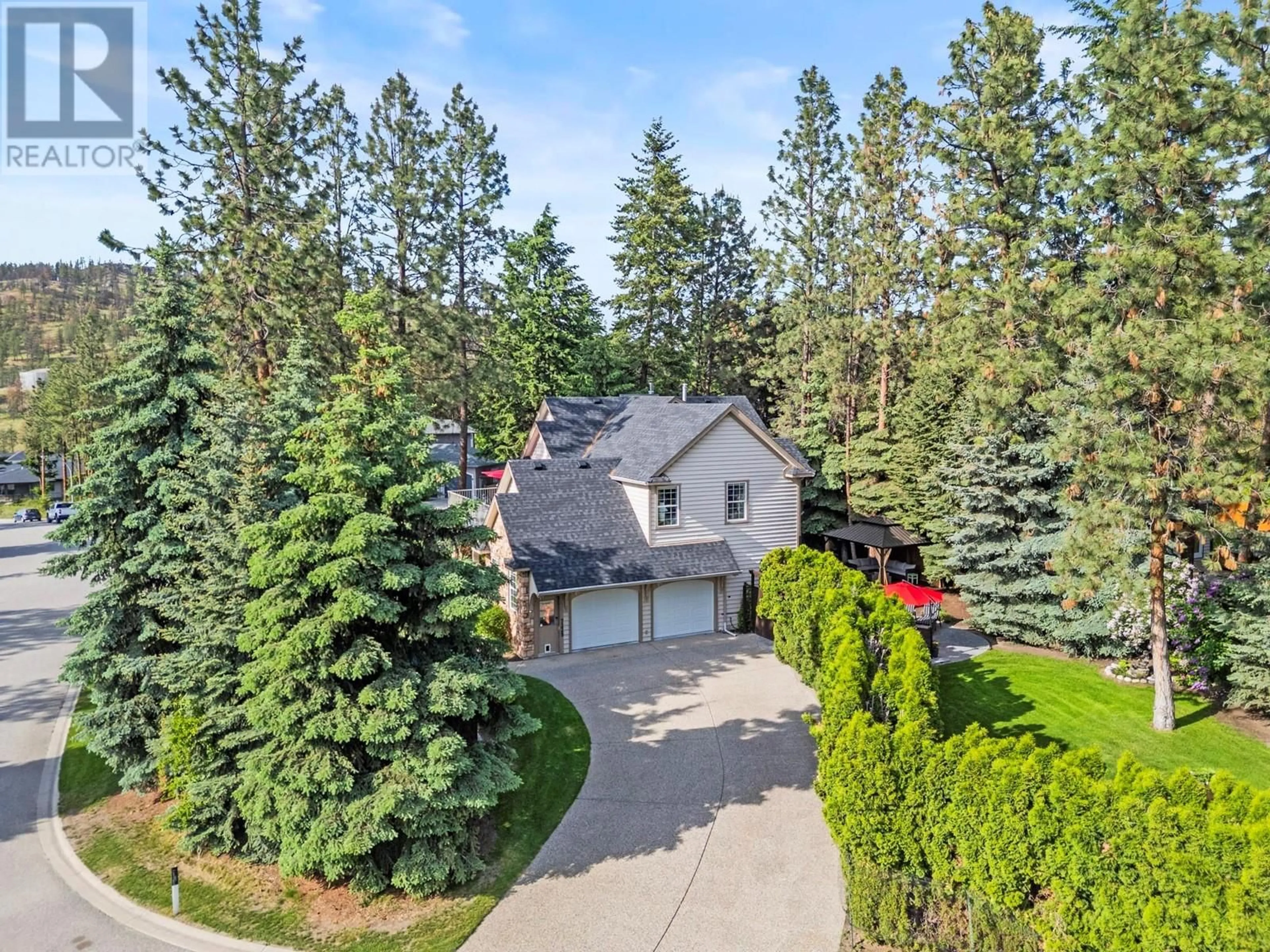 A pic from outside/outdoor area/front of a property/back of a property/a pic from drone, forest/trees view for 7229 HERITAGE COURT, Lake Country British Columbia V4V2L3