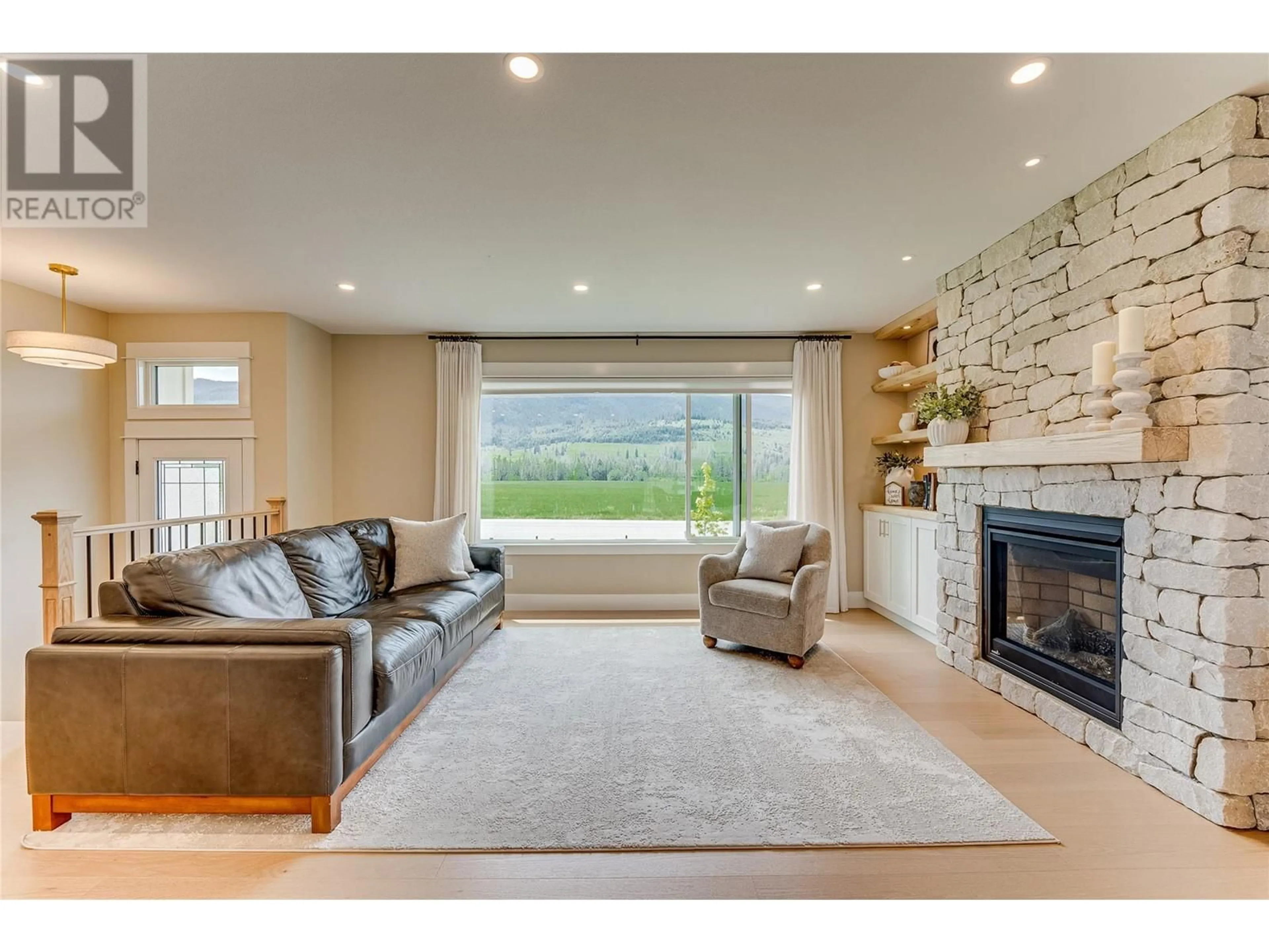 Living room with furniture, unknown for 8935 KALAMALKA ROAD, Coldstream British Columbia V1B3C2