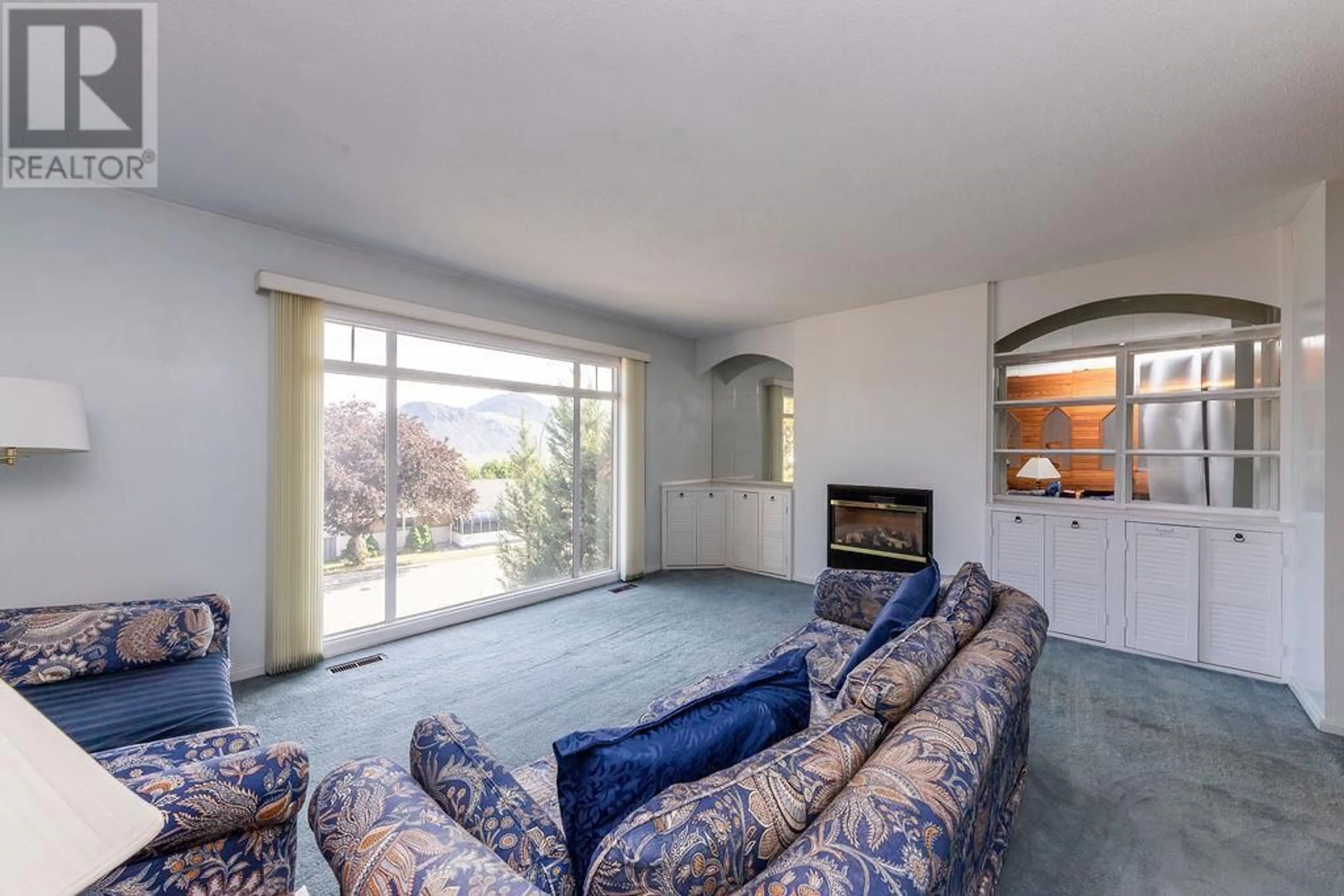 Living room with furniture, carpet floor for 255 GREENSTONE DRIVE, Kamloops British Columbia V2C1N6