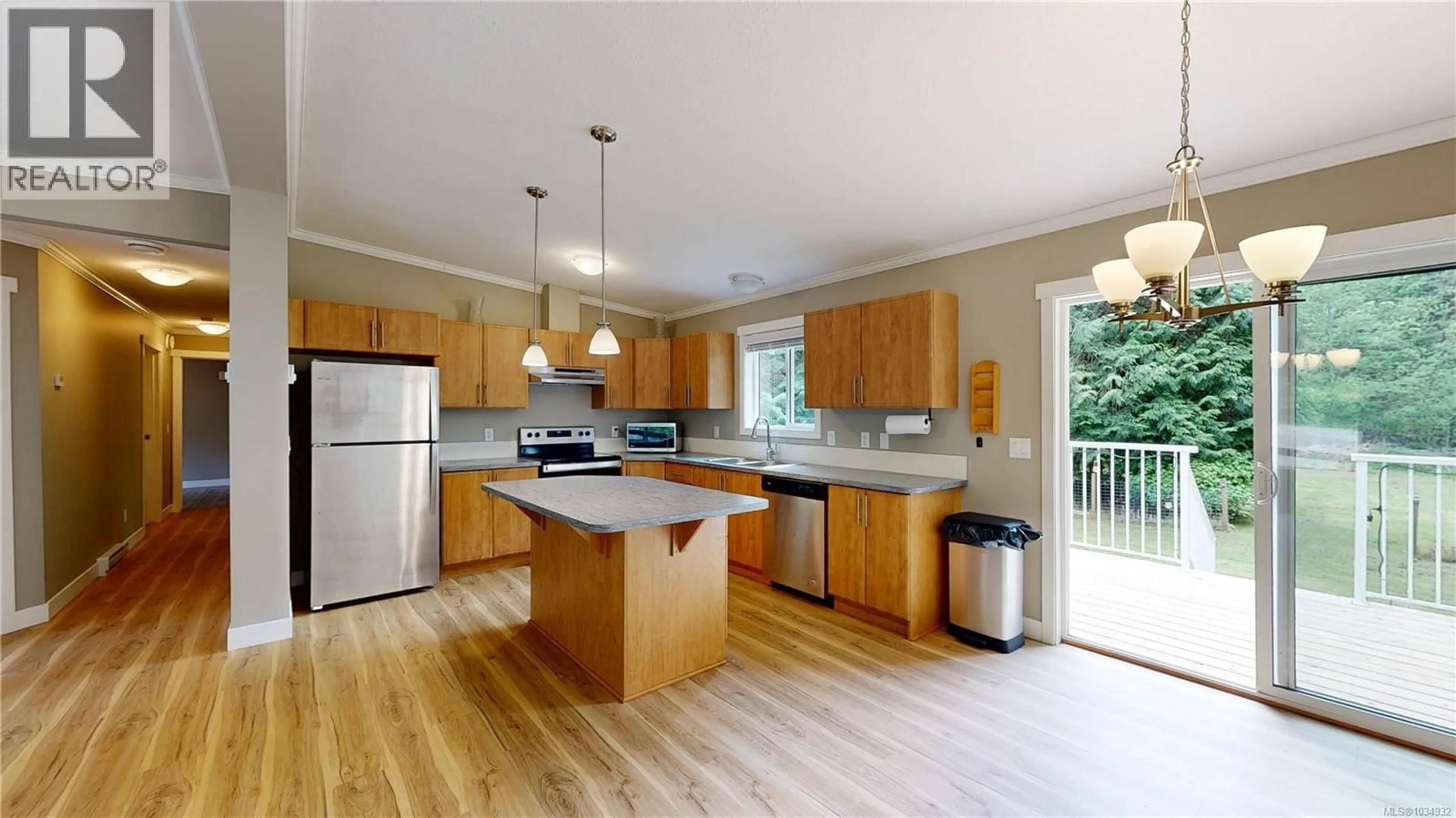 Open concept kitchen, wood/laminate floor for 601 WILDWOOD CRESCENT, Gabriola Island British Columbia V0R1X4