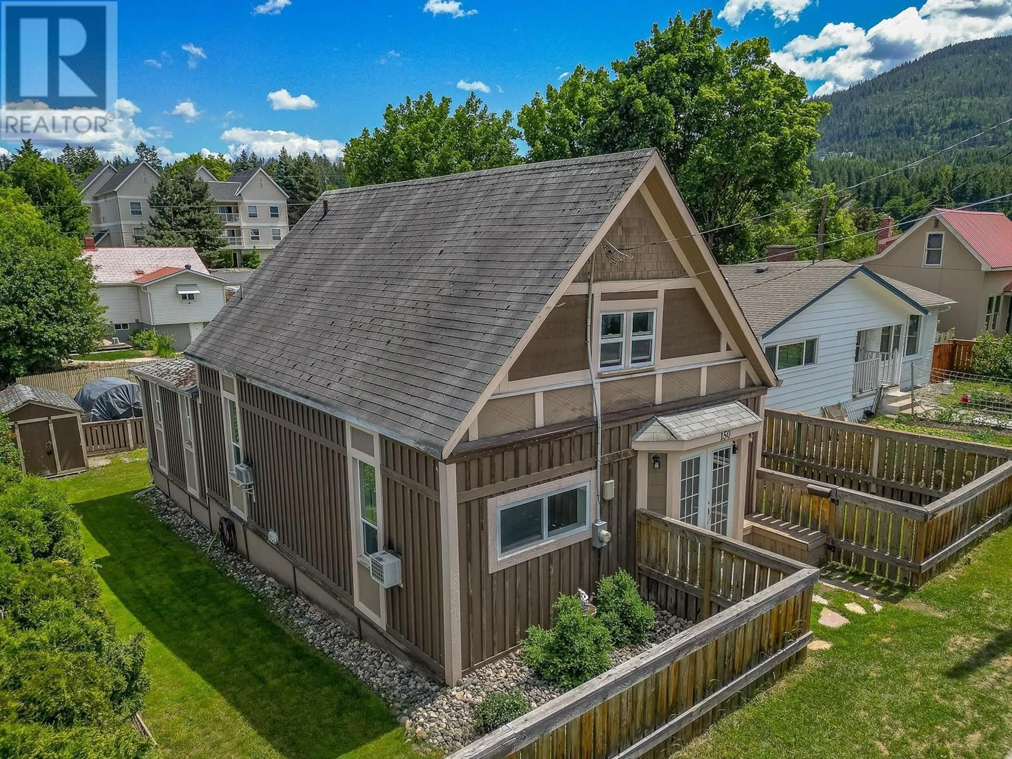 A pic from outside/outdoor area/front of a property/back of a property/a pic from drone, mountain view for 150 1 STREET SOUTHEAST, Salmon Arm British Columbia V1E4H5