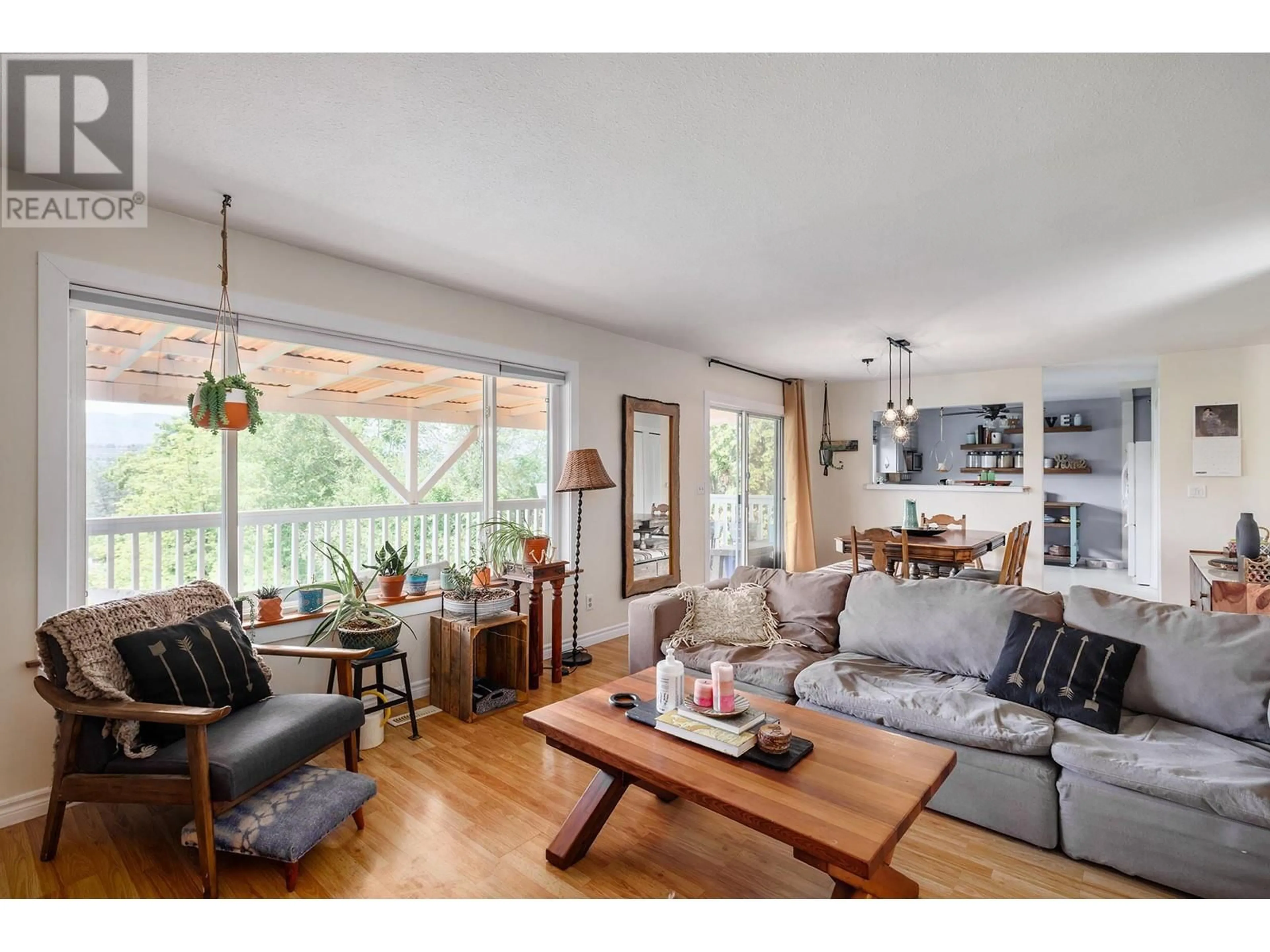 Living room with furniture, wood/laminate floor for 10556 CHERYL ROAD, Lake Country British Columbia V4V1W3