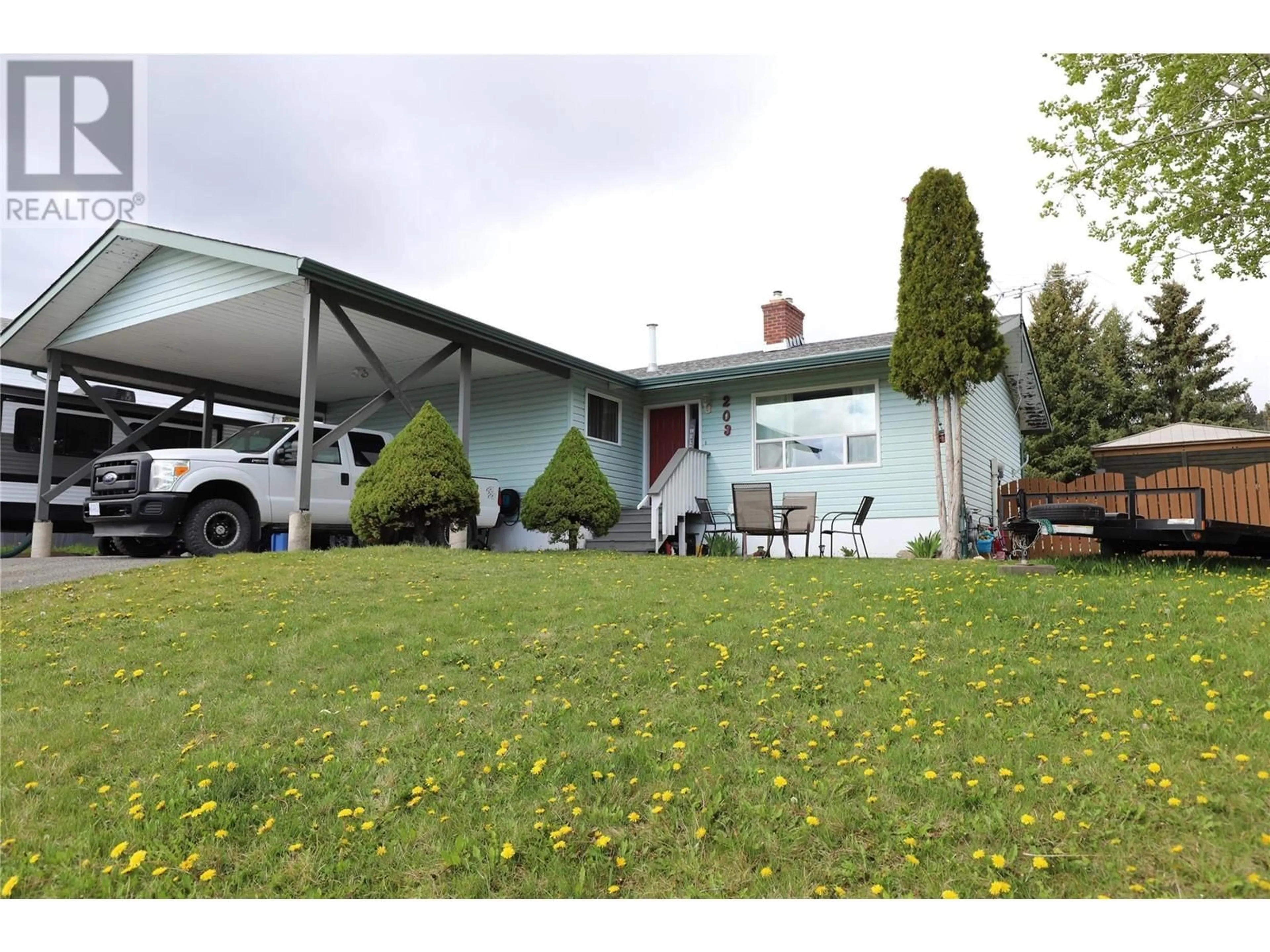 A pic from outside/outdoor area/front of a property/back of a property/a pic from drone, unknown for 203 TOPAZ CRESCENT, Logan Lake British Columbia V0K1W0