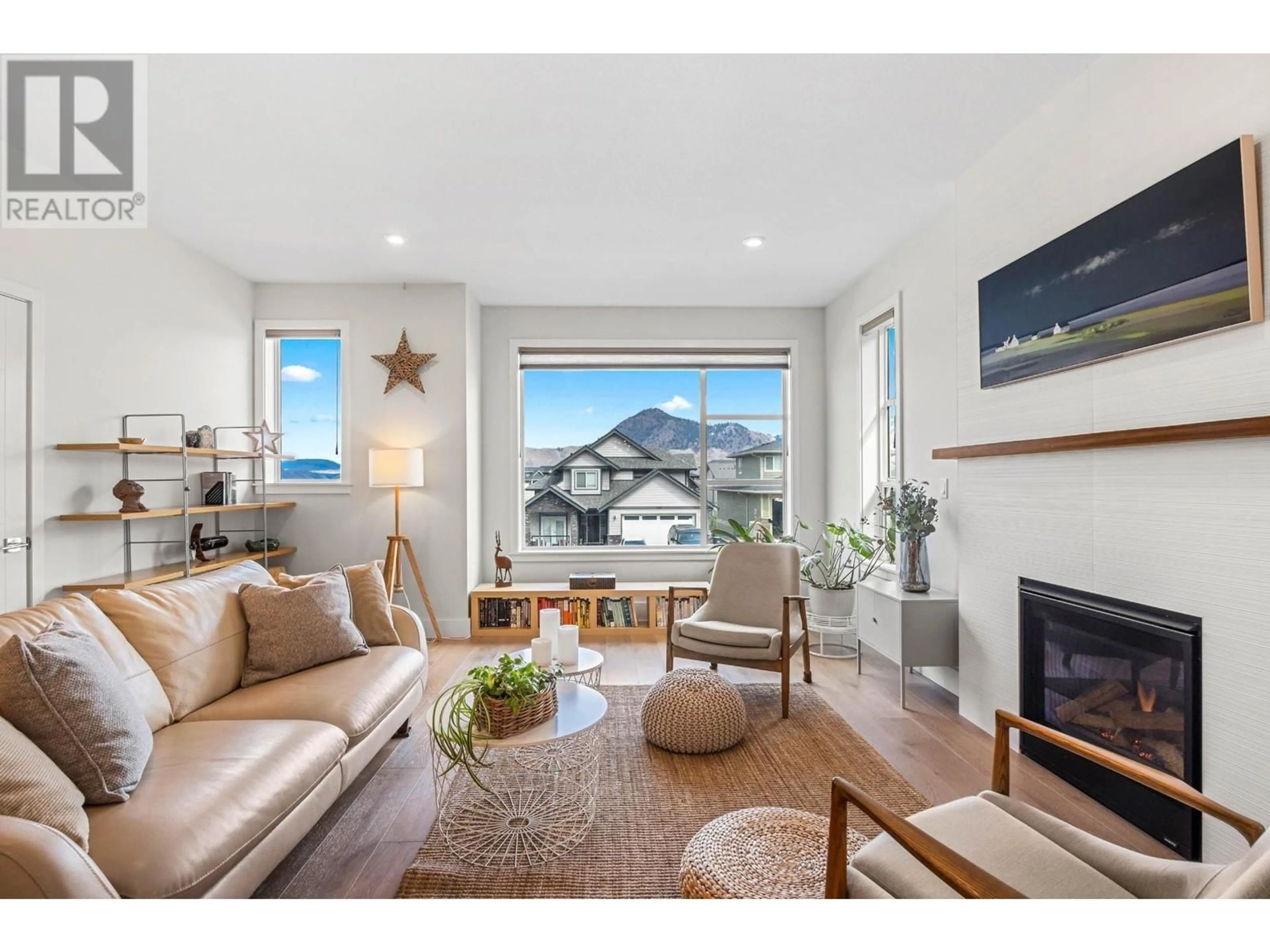Living room with furniture, wood/laminate floor for 1592 EMERALD DRIVE, Kamloops British Columbia V2E0C4