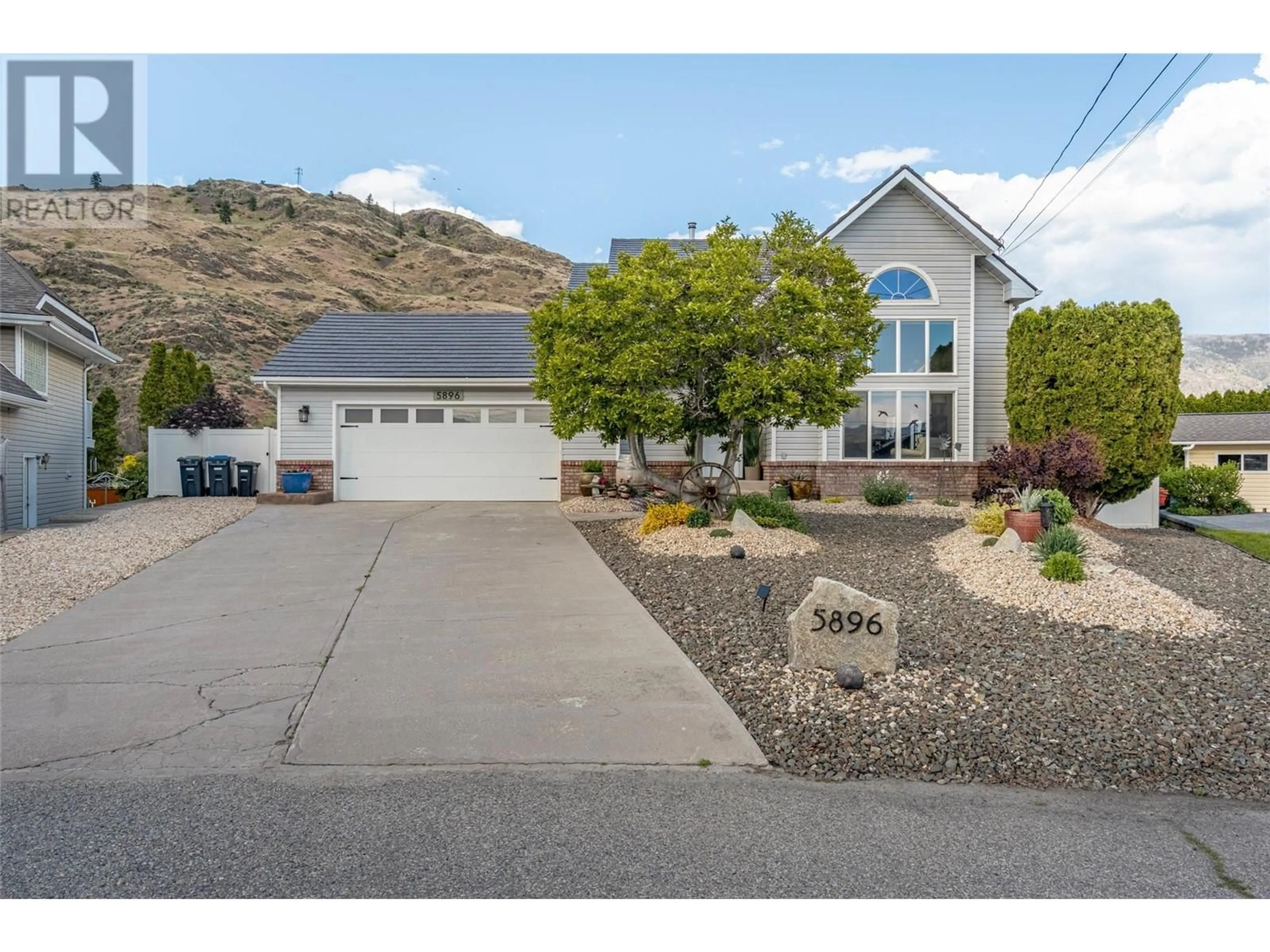Home with vinyl exterior material, mountain view for 5896 FAIRVIEW PLACE, Oliver British Columbia V0H1T1