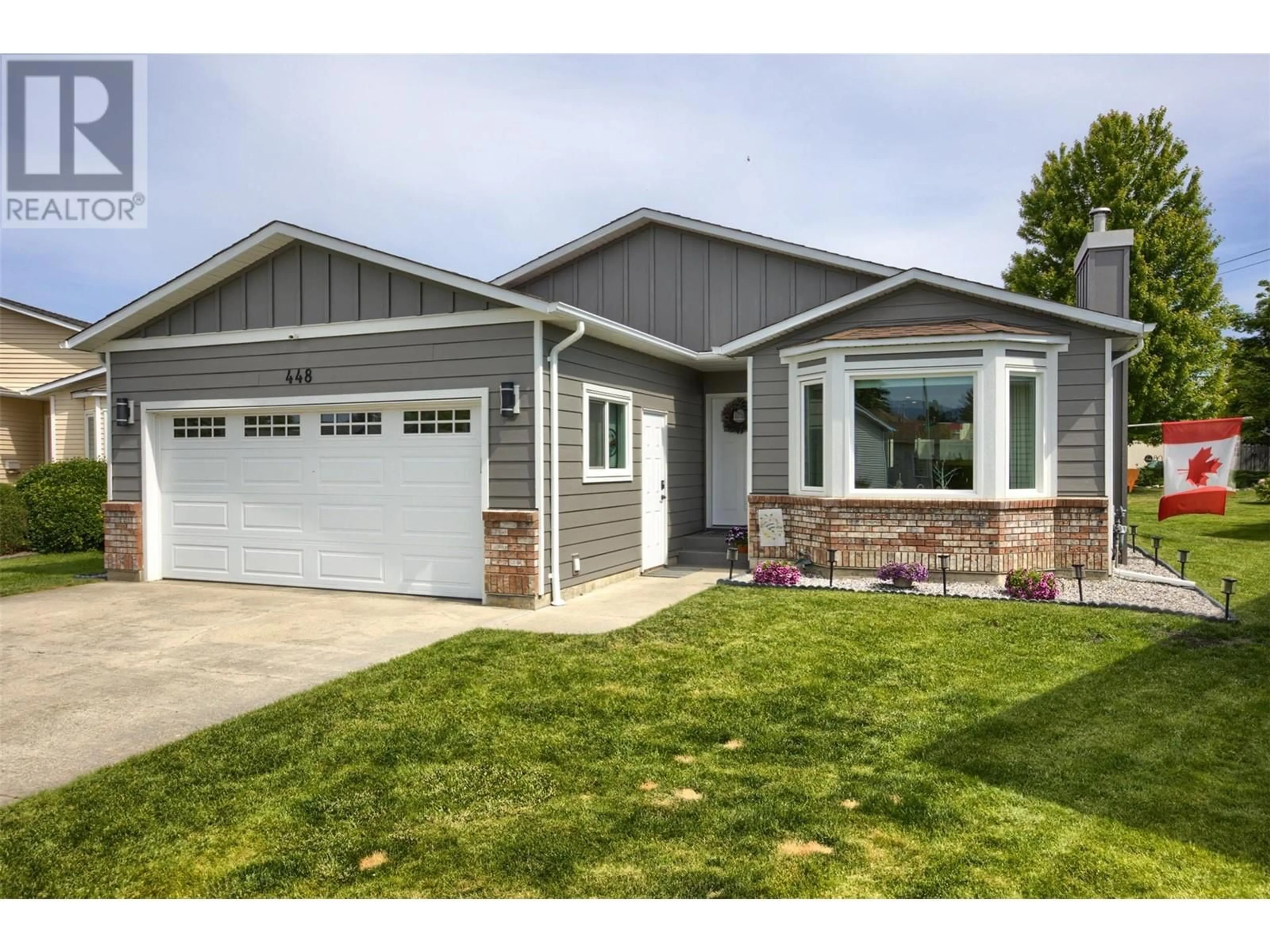 Home with vinyl exterior material, street for 448 LAKEWAY DRIVE, Kelowna British Columbia V1W3S4
