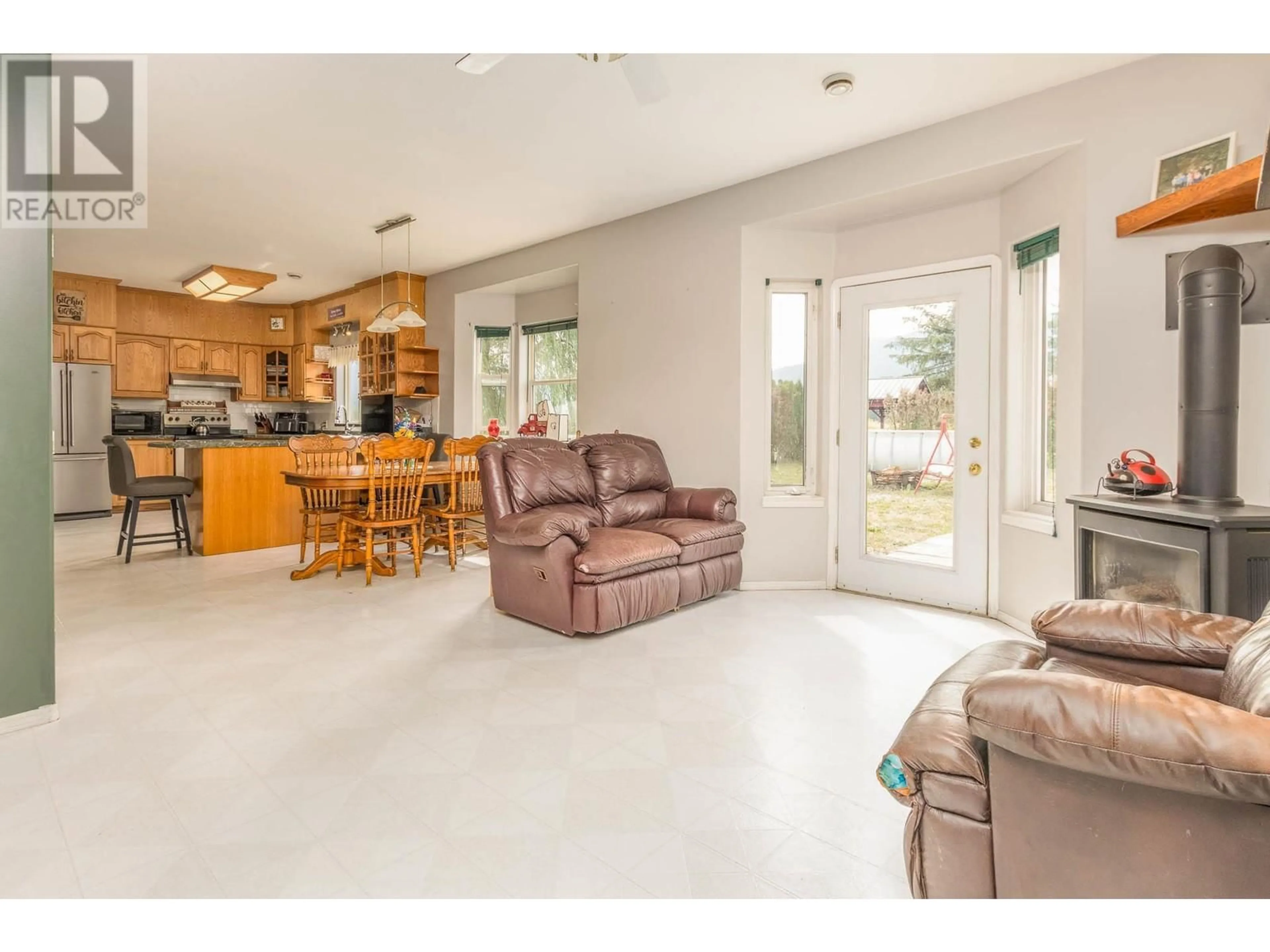 Open concept kitchen, ceramic/tile floor for 3695 MALAKWA LOOP ROAD, Malakwa British Columbia V0E2J0