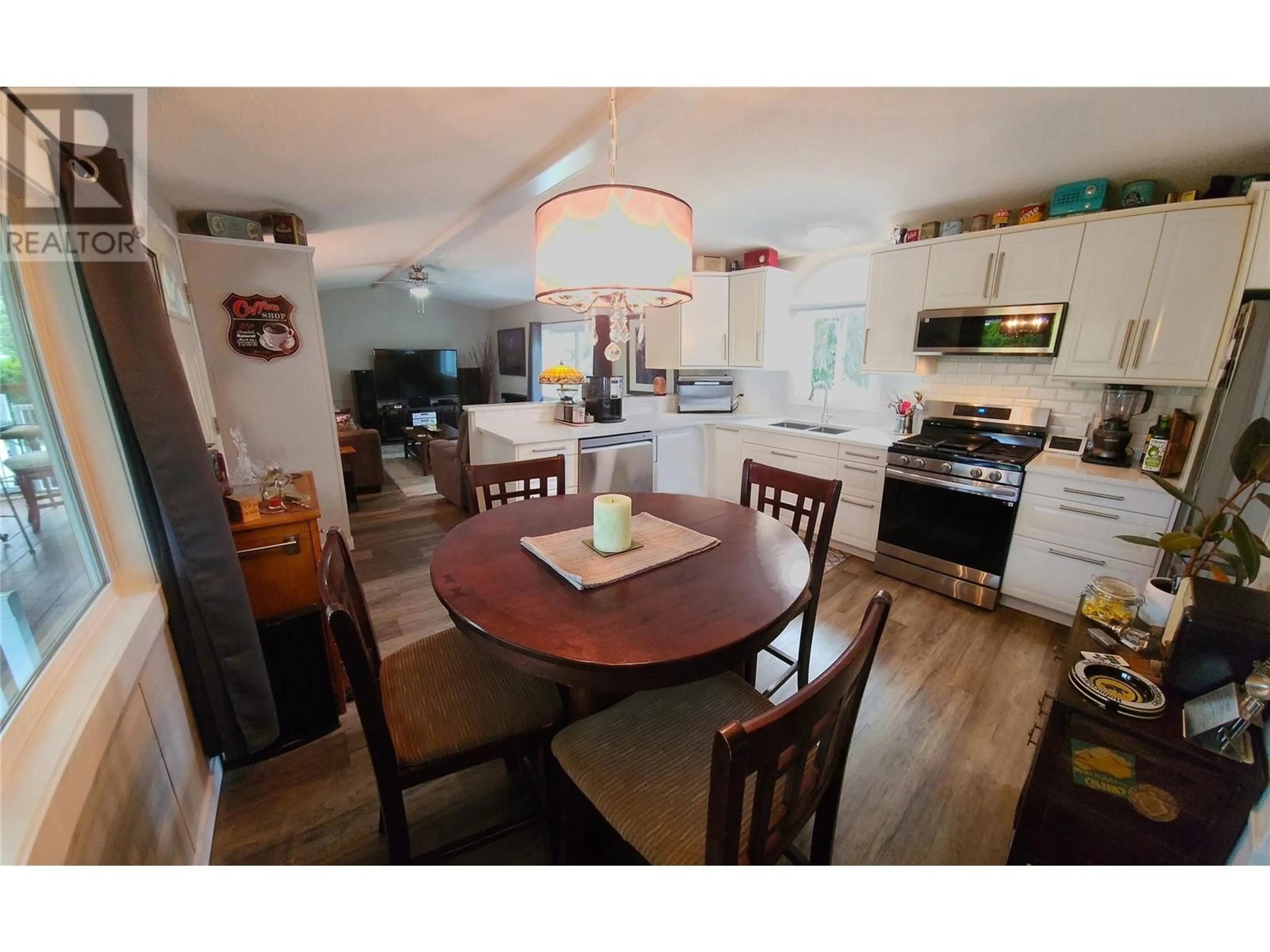 Open concept kitchen, wood/laminate floor for 715 10TH AVENUE, Keremeos British Columbia V0X1N3