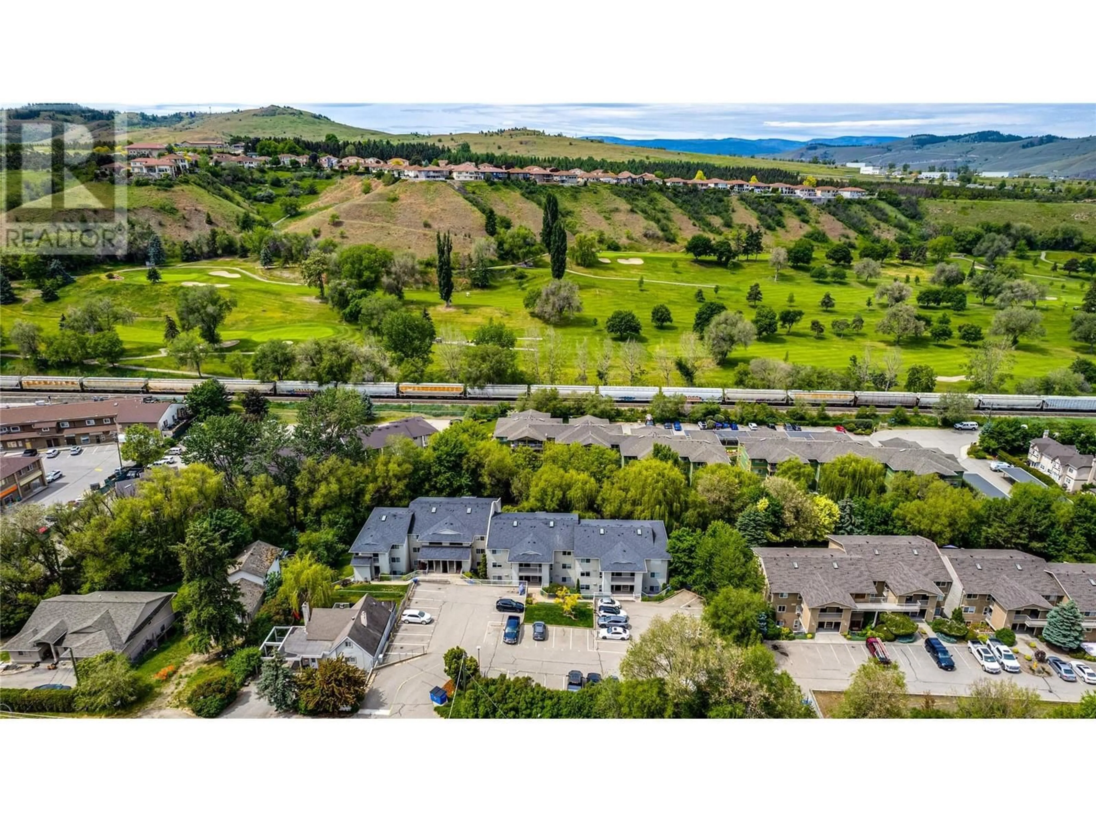 A pic from outside/outdoor area/front of a property/back of a property/a pic from drone, water/lake/river/ocean view for 207 - 204 KALAMALKA LAKE ROAD, Vernon British Columbia V1T7M3