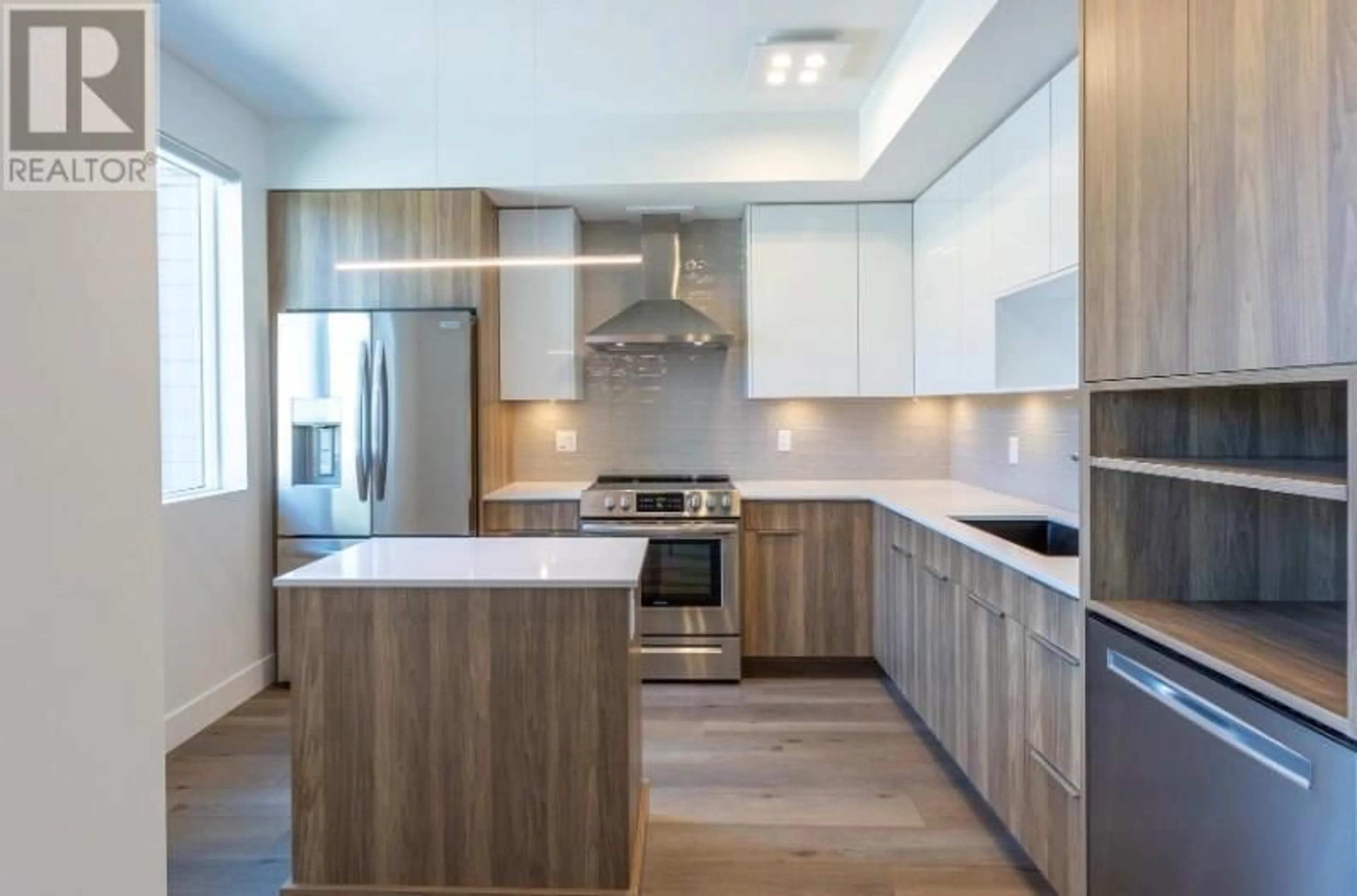 Contemporary kitchen, wood/laminate floor for 303 - 3642 MISSION SPRINGS DRIVE, Kelowna British Columbia V1W0E1