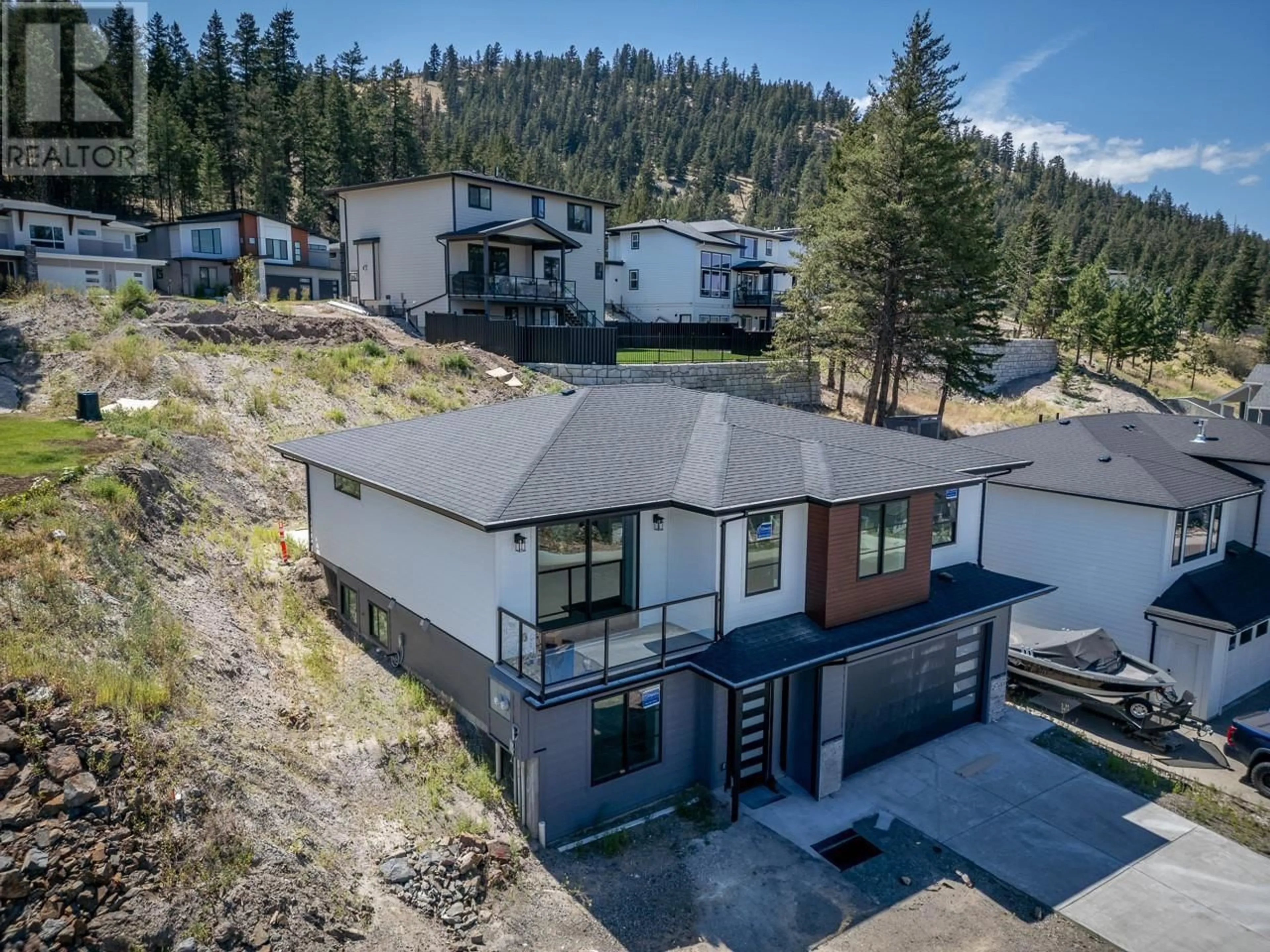 A pic from outside/outdoor area/front of a property/back of a property/a pic from drone, mountain view for 1725 BALSAM PLACE, Kamloops British Columbia V2E0E2