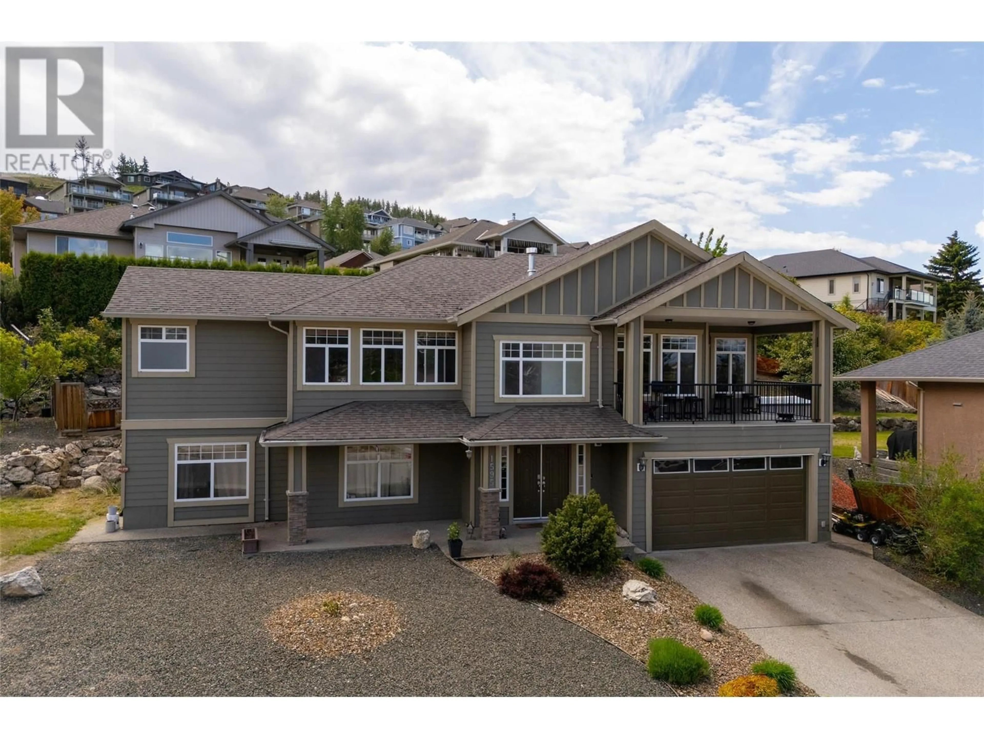Home with vinyl exterior material, street for 1595 KLOPPENBURG ROAD, Kelowna British Columbia V1P1N5