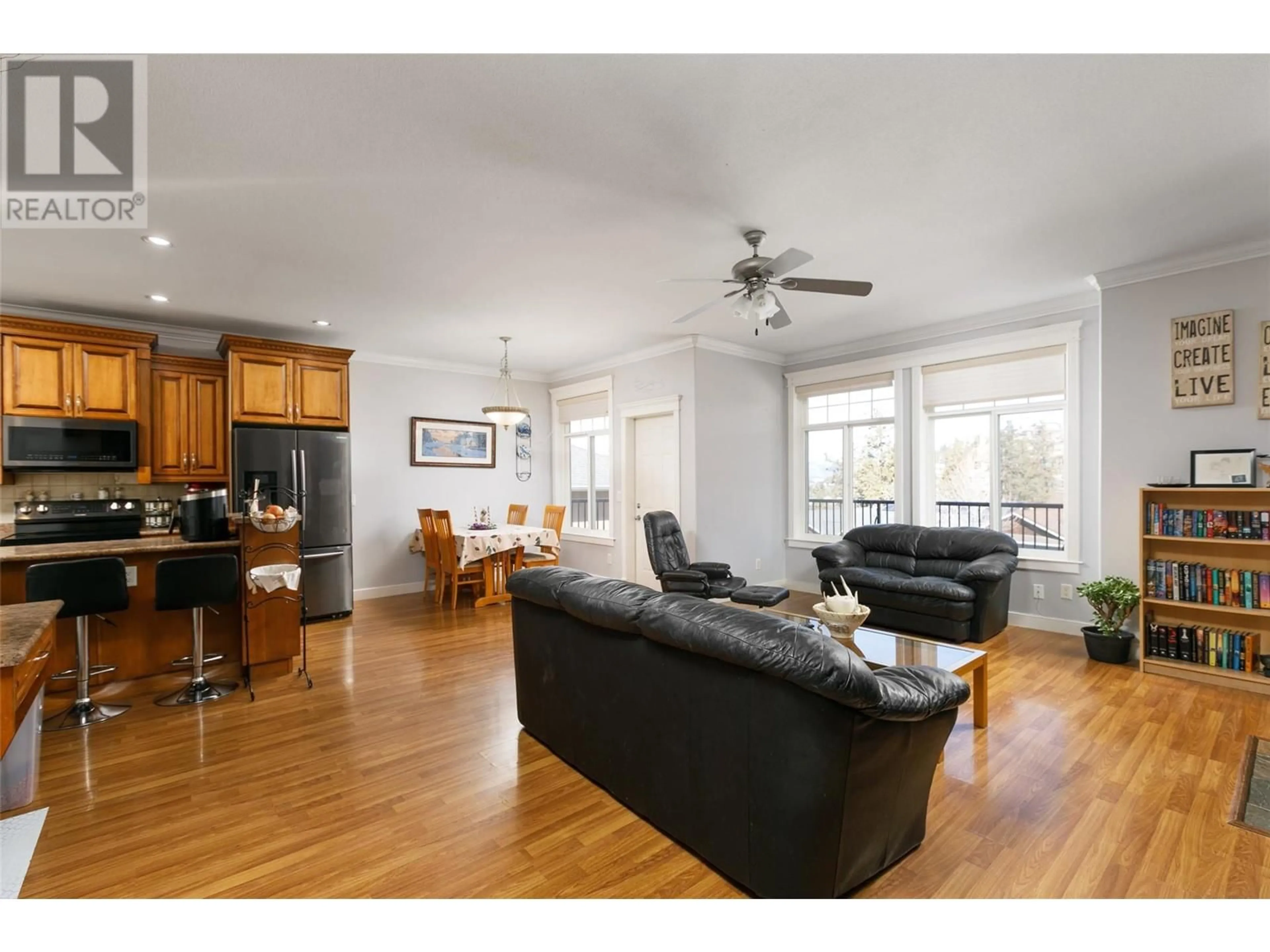 Living room with furniture, wood/laminate floor for 1595 KLOPPENBURG ROAD, Kelowna British Columbia V1P1N5