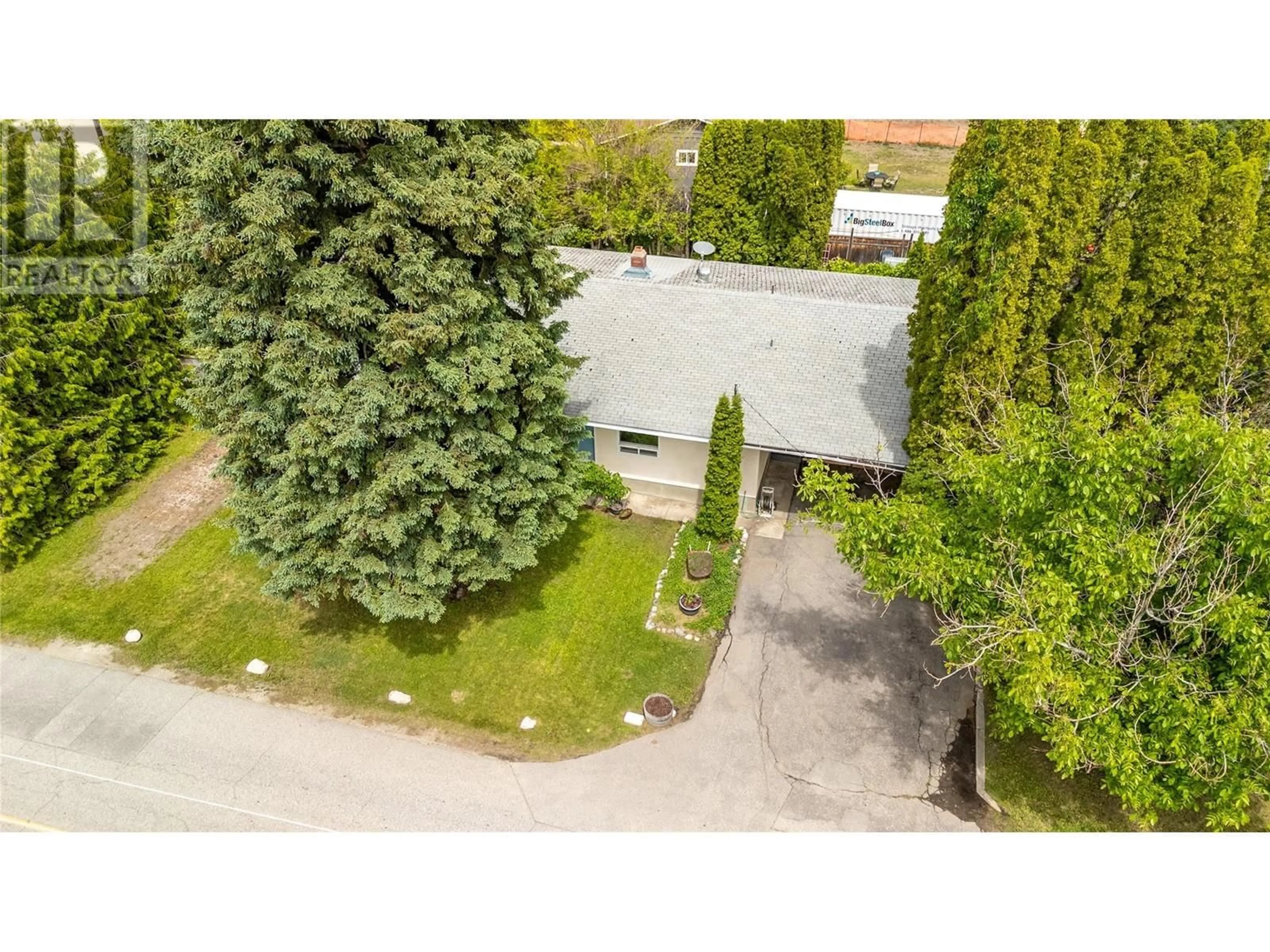 A pic from outside/outdoor area/front of a property/back of a property/a pic from drone, street for 9718 QUINPOOL ROAD, Summerland British Columbia V0H1Z0