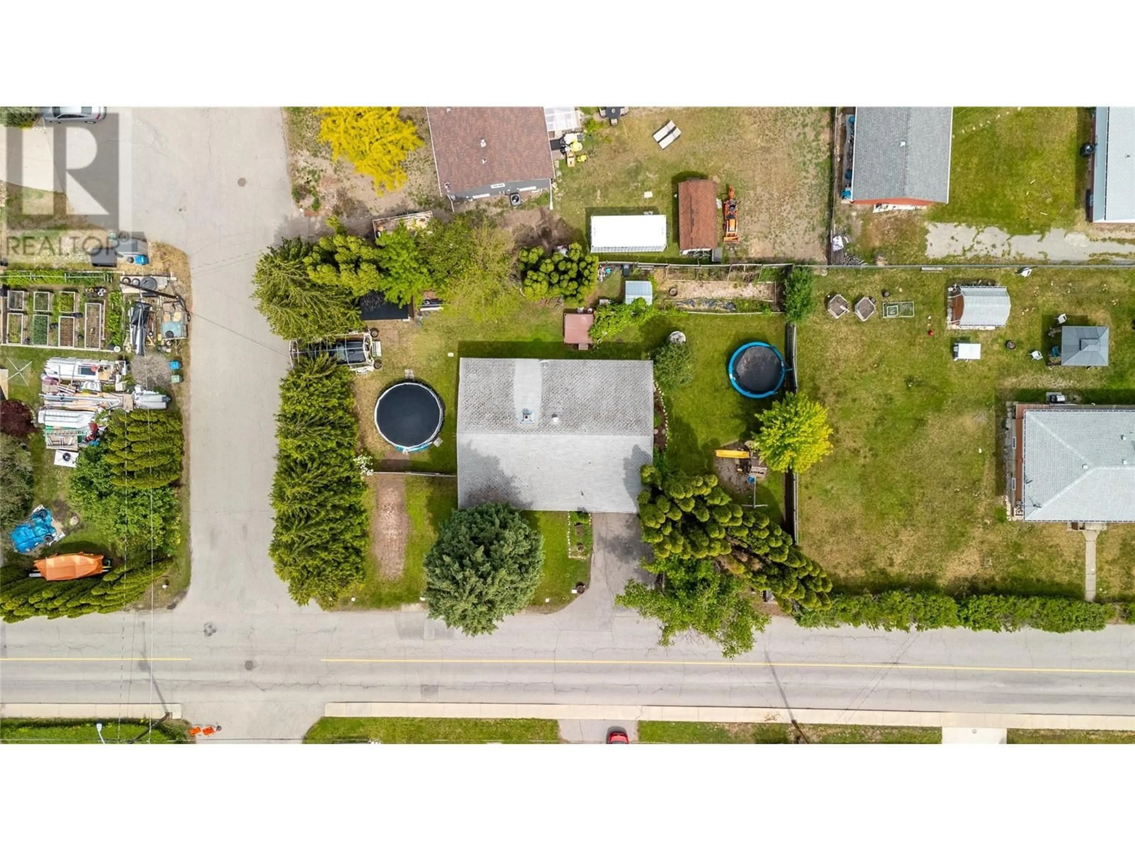 A pic from outside/outdoor area/front of a property/back of a property/a pic from drone, street for 9718 QUINPOOL ROAD, Summerland British Columbia V0H1Z0