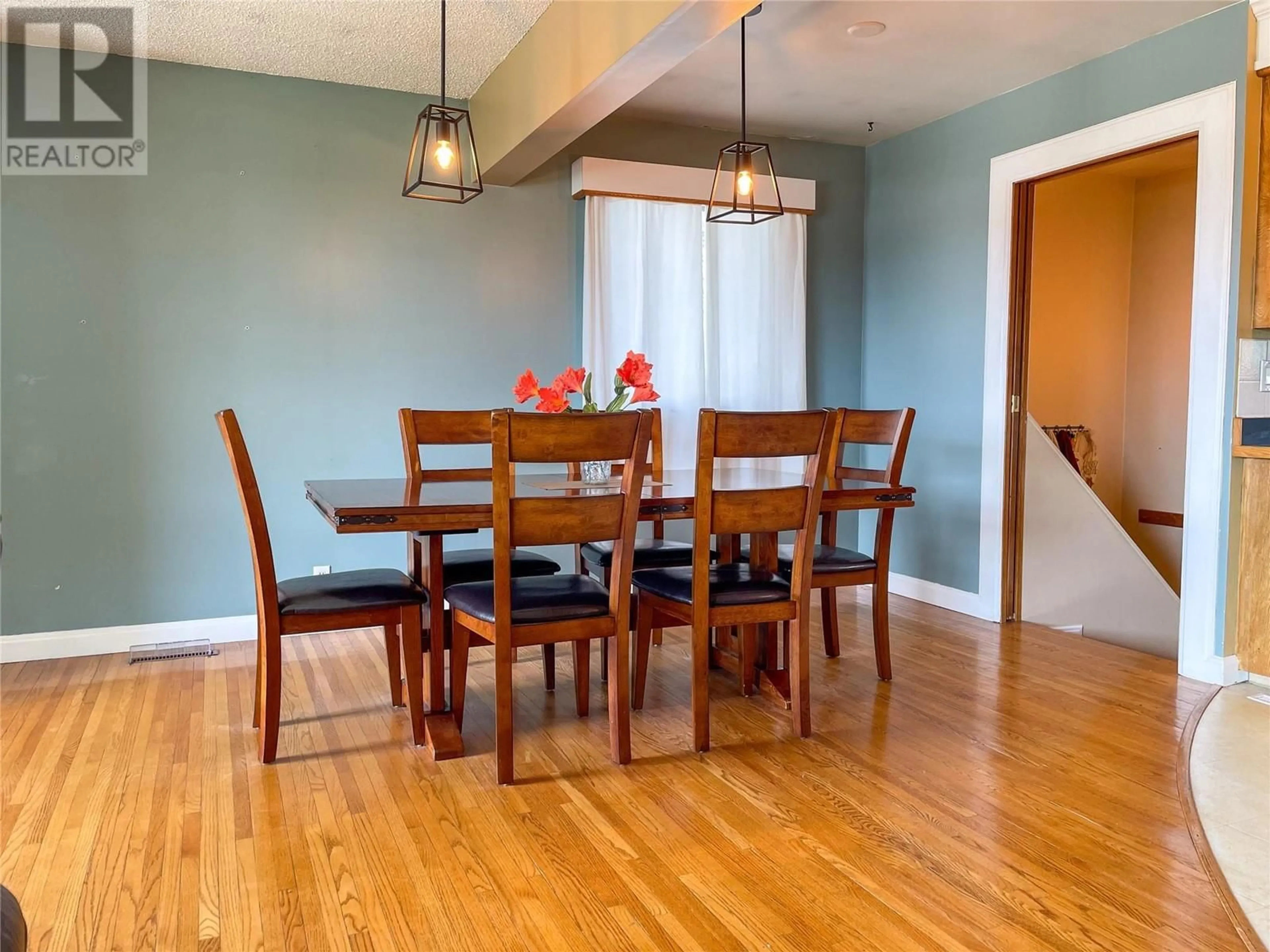 Dining room, wood/laminate floor for 1308 94 AVENUE, Dawson Creek British Columbia V1G1G6