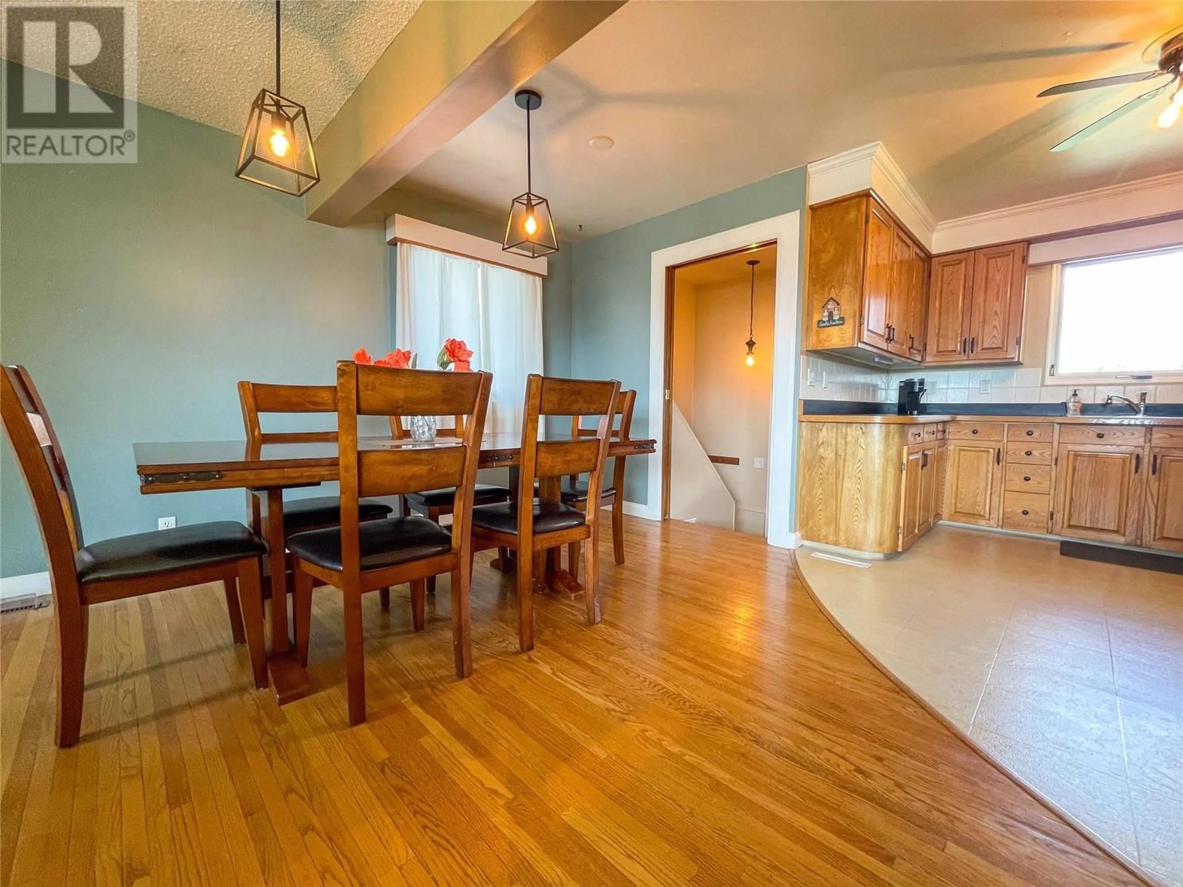 Dining room, wood/laminate floor for 1308 94 AVENUE, Dawson Creek British Columbia V1G1G6