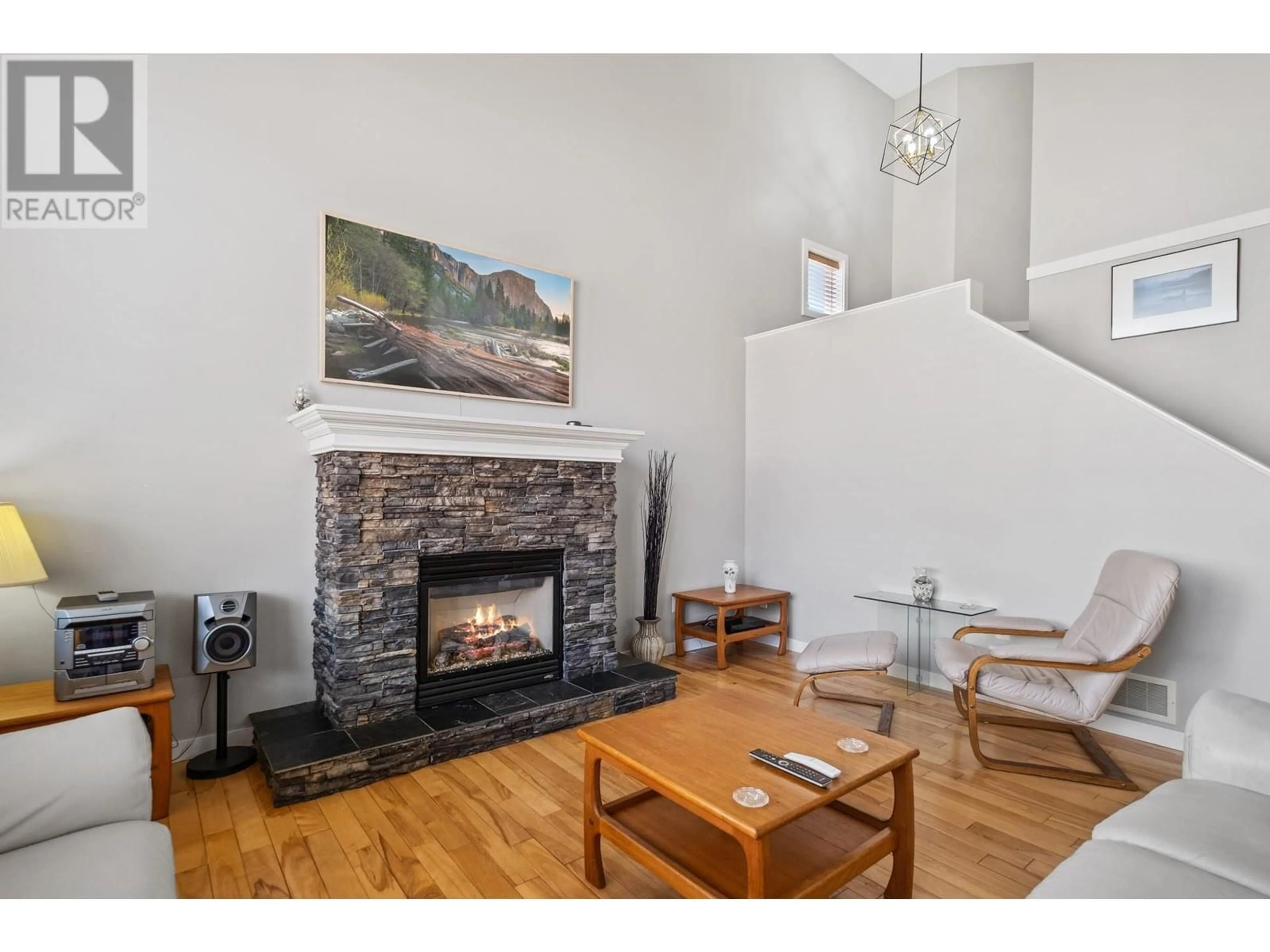 Living room with furniture, wood/laminate floor for 3501 CREEKVIEW CRESCENT, West Kelowna British Columbia V4T3C5