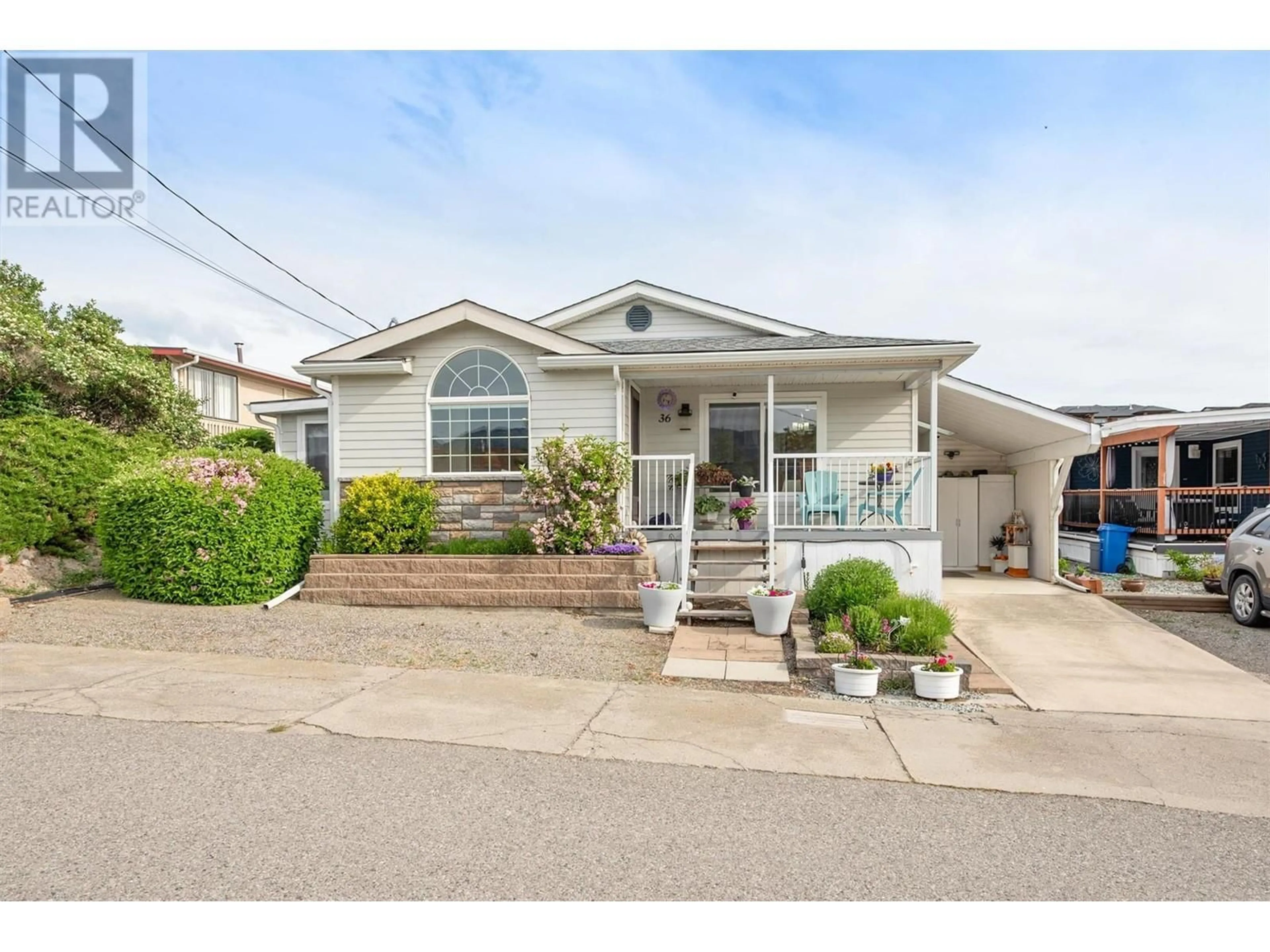 Home with vinyl exterior material, street for 36 - 2098 BOUCHERIE ROAD, West Kelowna British Columbia V4T2A5