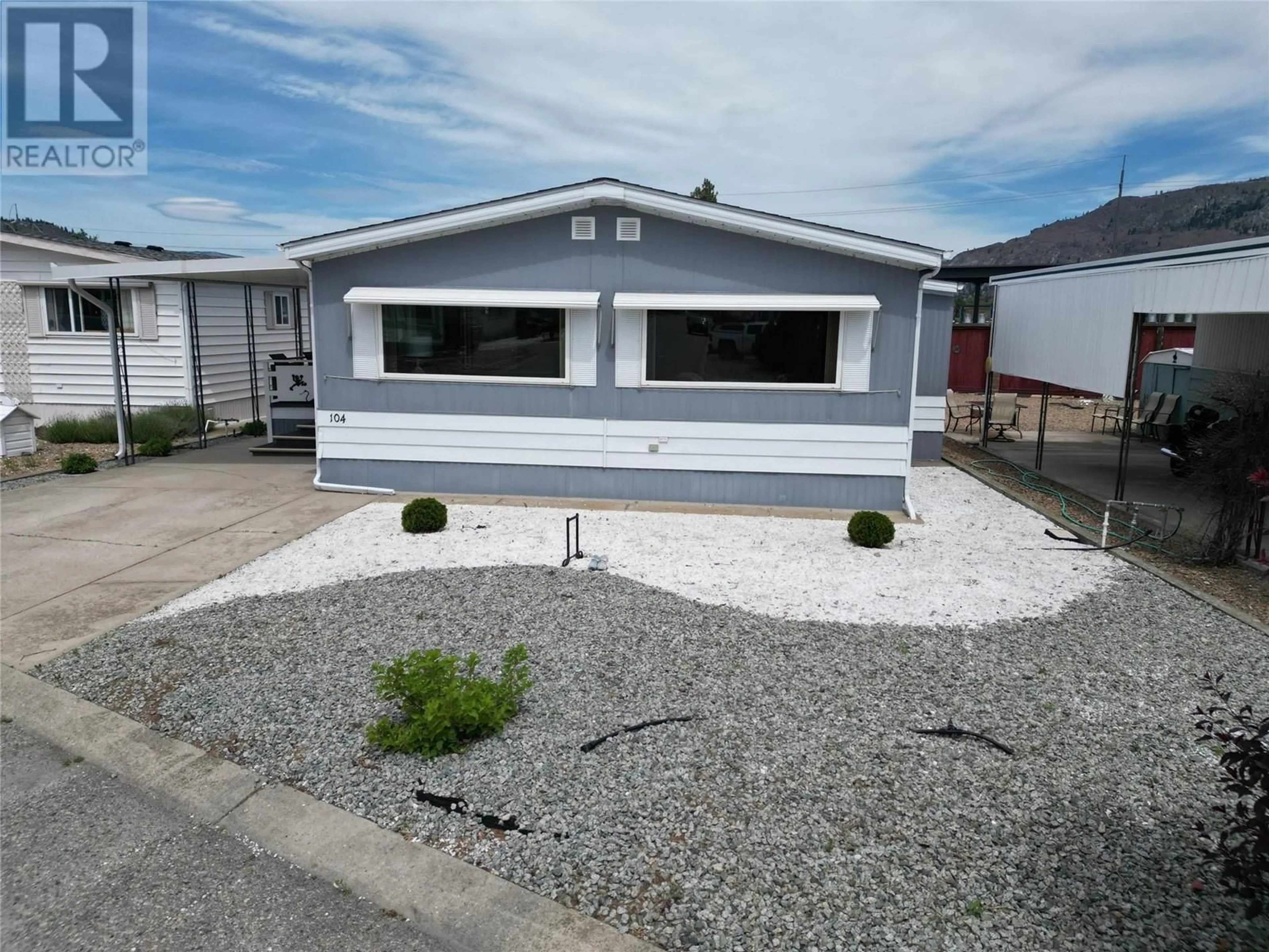 Home with vinyl exterior material, street for 104 - 6601 TUCELNUIT DRIVE, Oliver British Columbia V0H1T3
