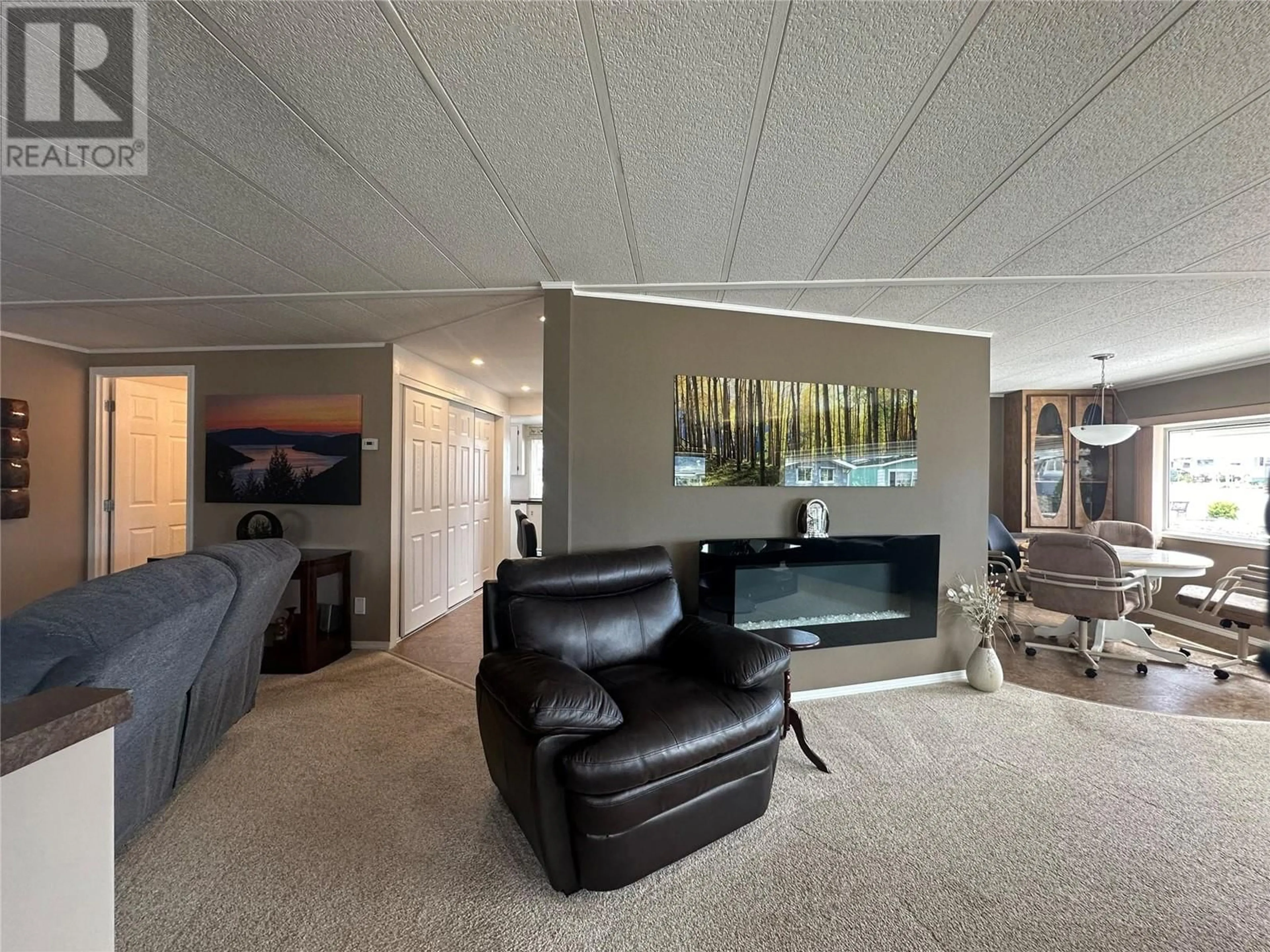 Living room with furniture, unknown for 104 - 6601 TUCELNUIT DRIVE, Oliver British Columbia V0H1T3