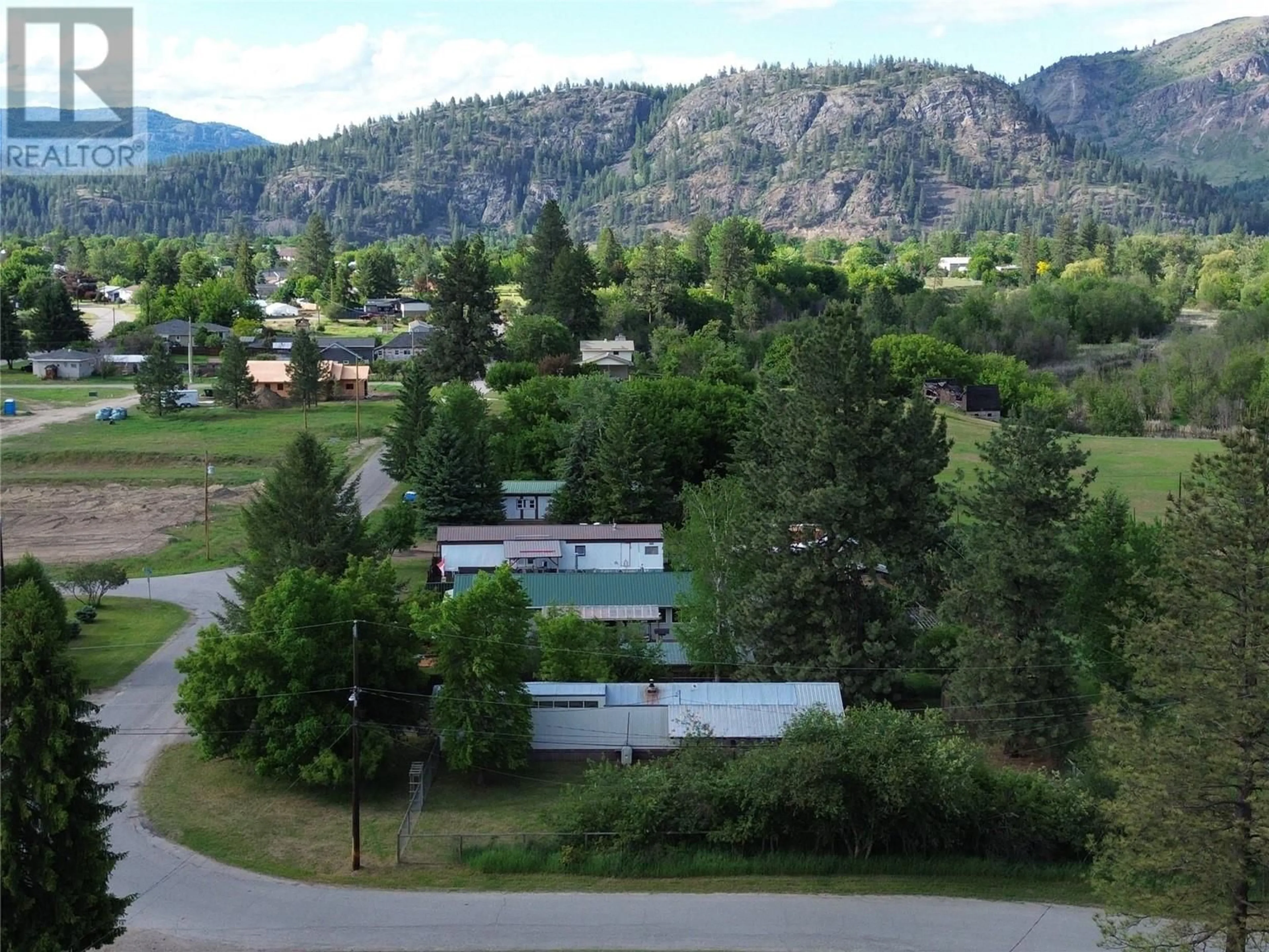 A pic from outside/outdoor area/front of a property/back of a property/a pic from drone, mountain view for 5930 18TH STREET, Grand Forks British Columbia V0H1H0