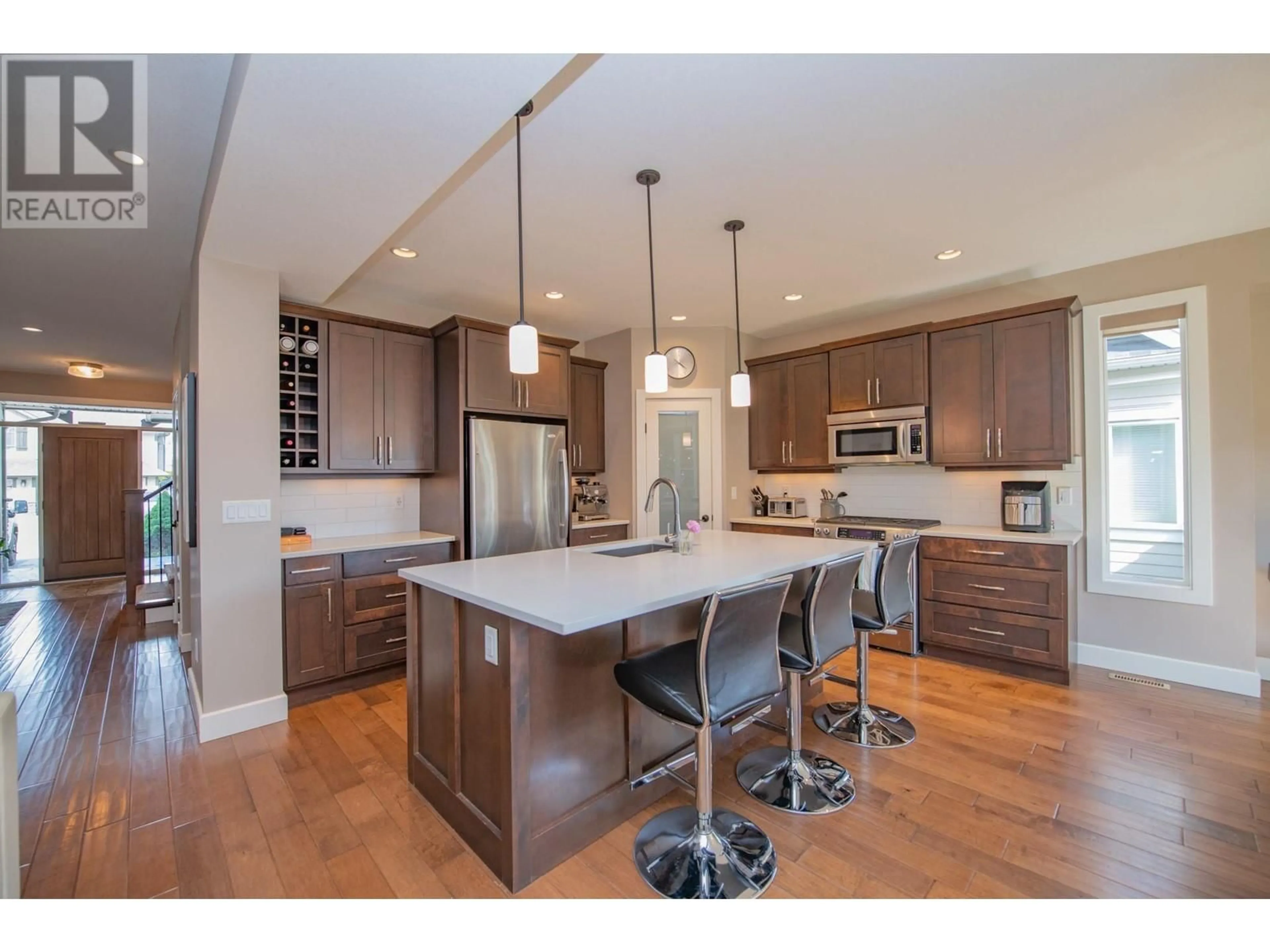 Open concept kitchen, wood/laminate floor for 3905 RANKINE PLACE, Armstrong British Columbia v4y0x9
