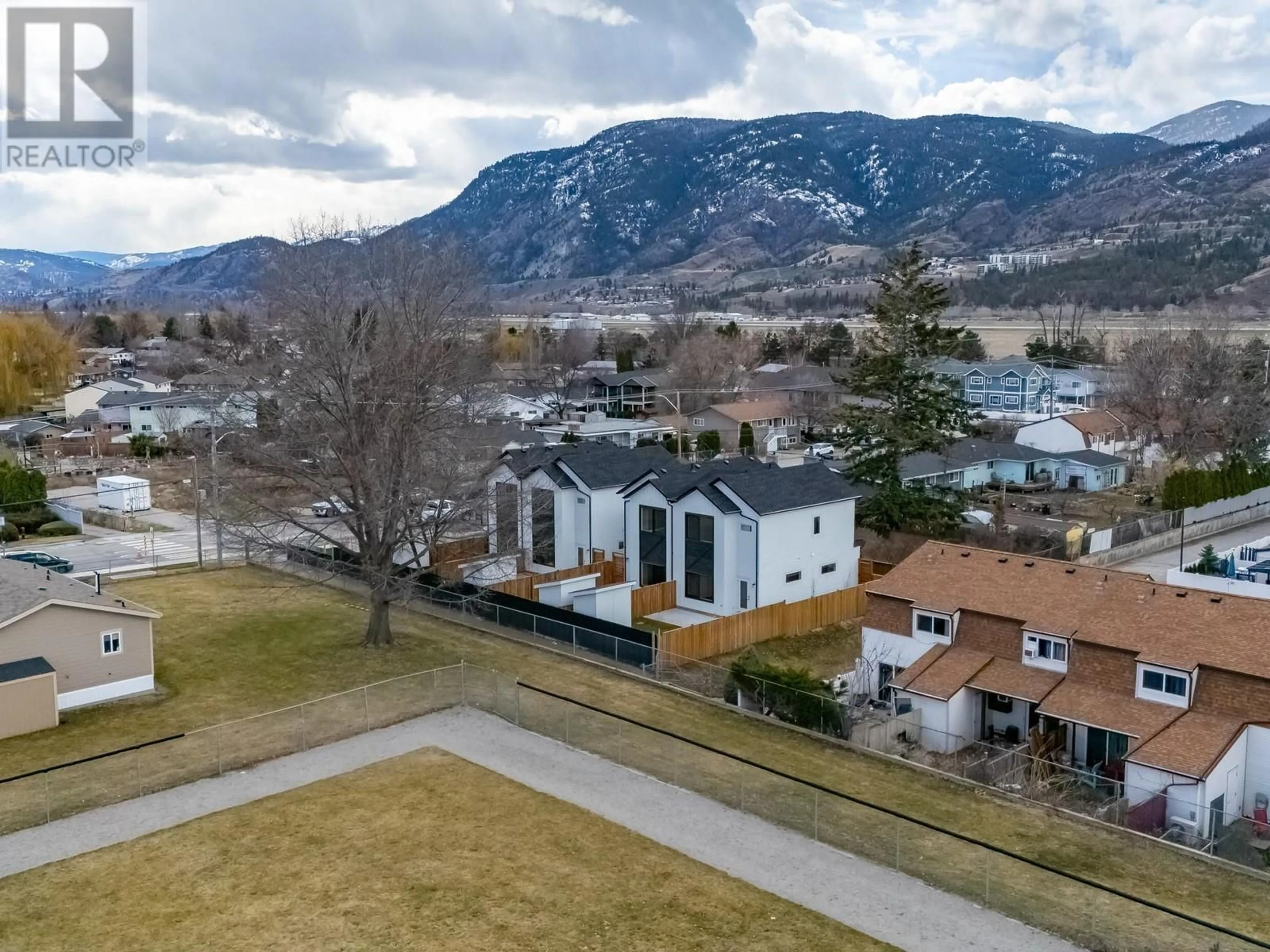 A pic from outside/outdoor area/front of a property/back of a property/a pic from drone, mountain view for 103 - 275 KINNEY AVENUE, Penticton British Columbia V2A3P3