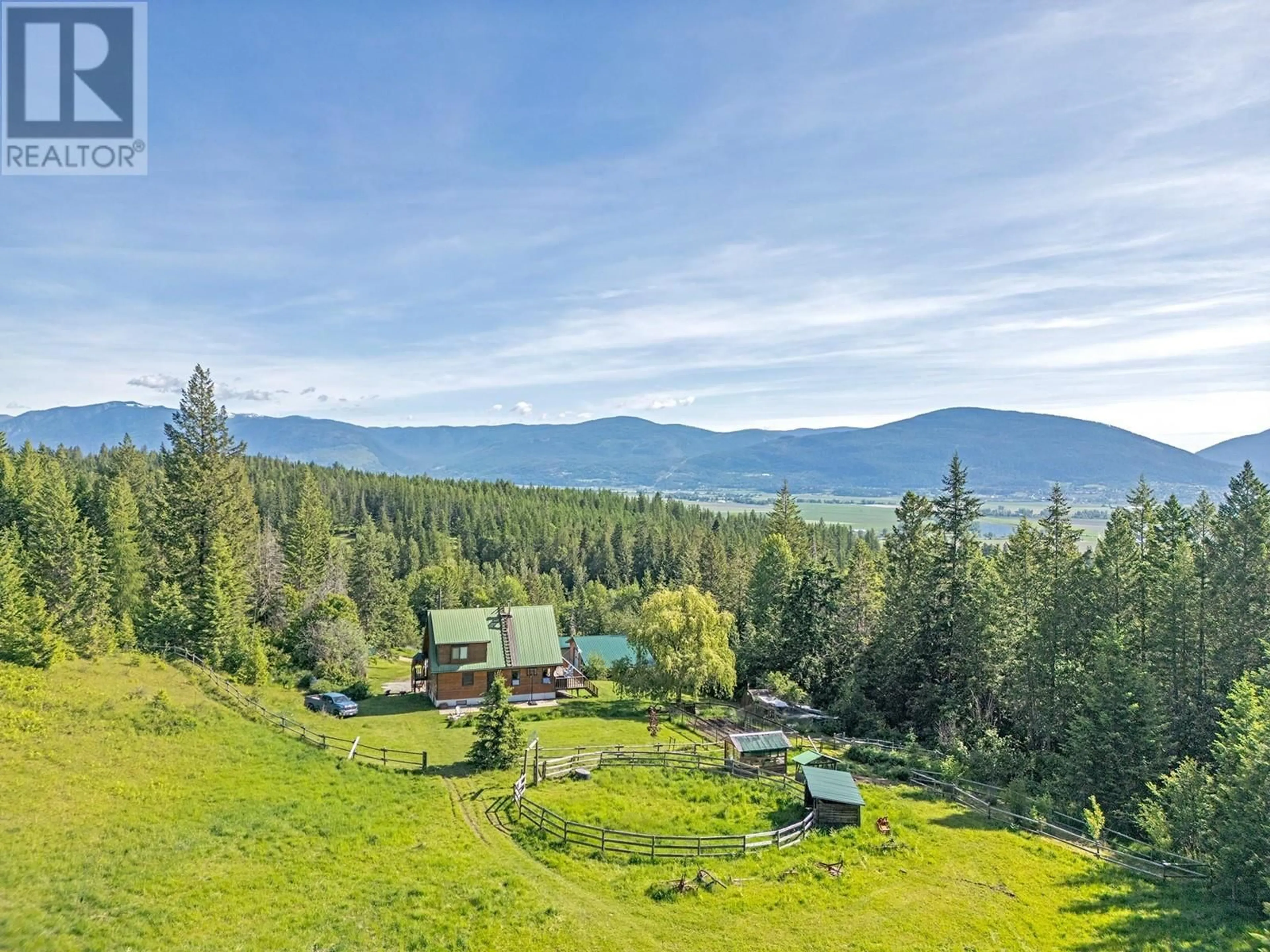 A pic from outside/outdoor area/front of a property/back of a property/a pic from drone, mountain view for 2033 SMITH ROAD, Creston British Columbia V0B1G7