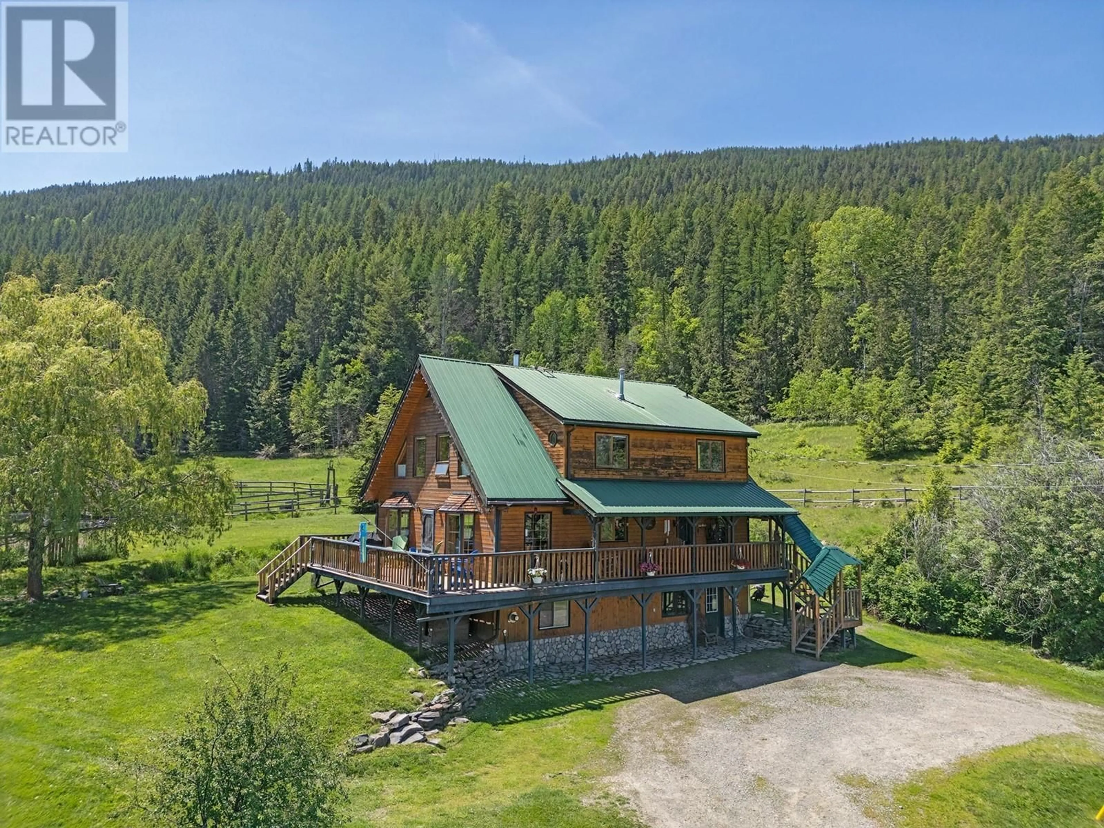 A pic from outside/outdoor area/front of a property/back of a property/a pic from drone, mountain view for 2033 SMITH ROAD, Creston British Columbia V0B1G7