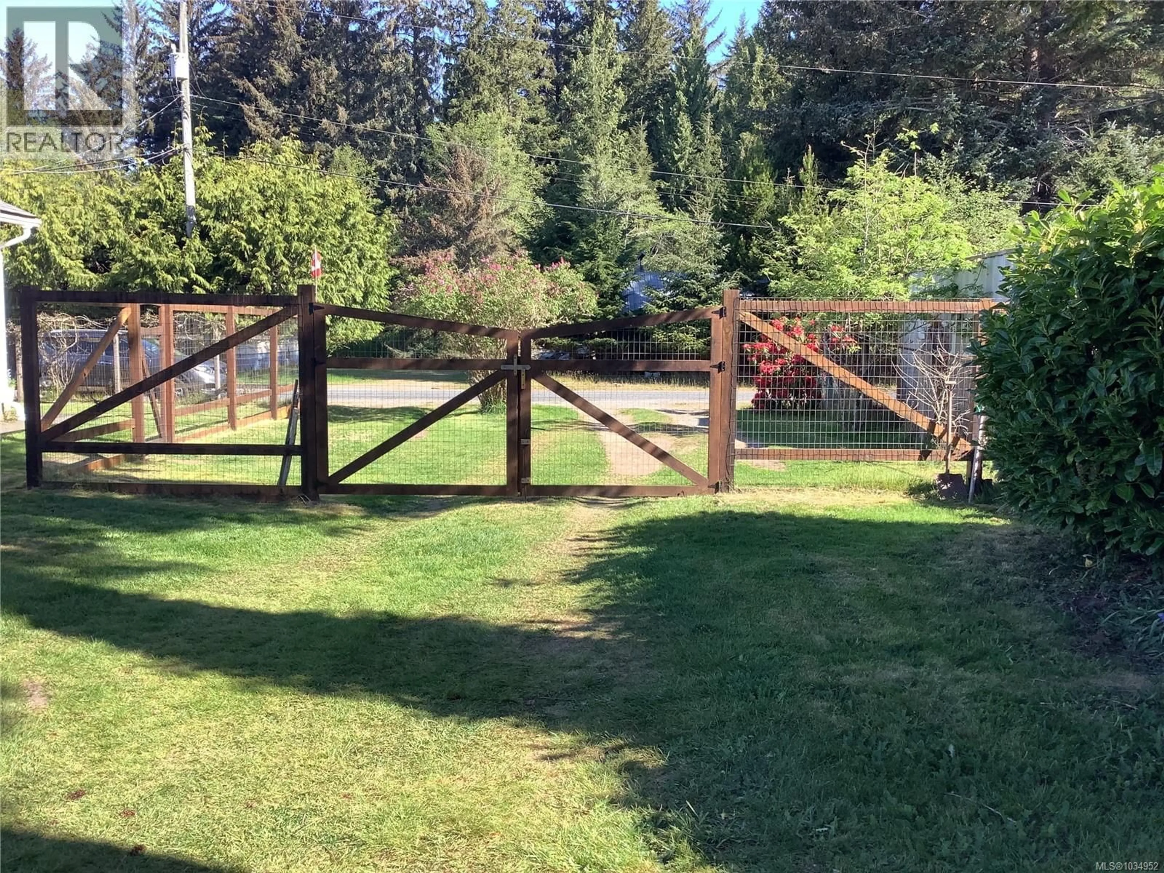 A pic from outside/outdoor area/front of a property/back of a property/a pic from drone, forest/trees view for 115 RUPERT AVENUE, Sointula British Columbia V0N3E0