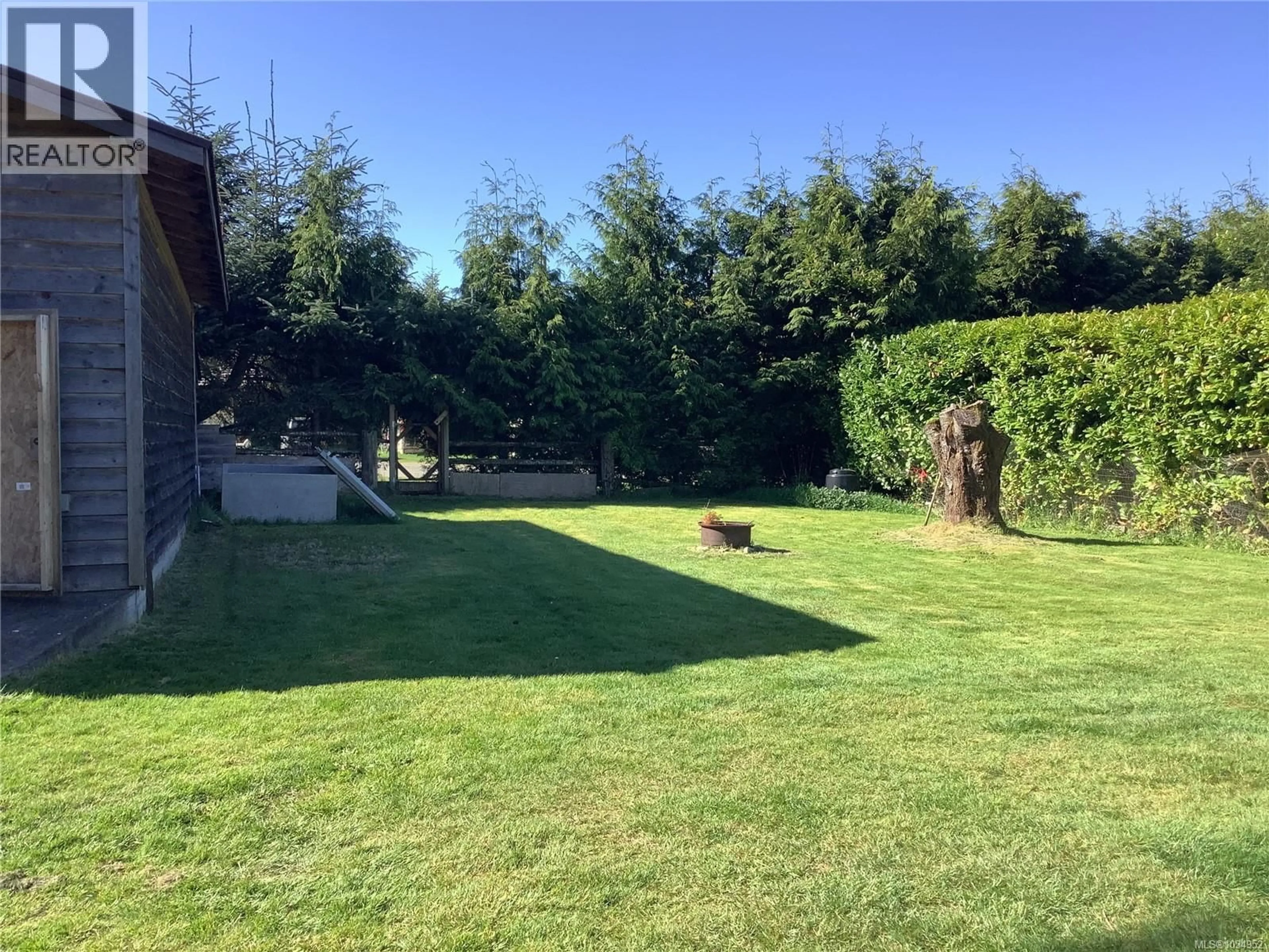 A pic from outside/outdoor area/front of a property/back of a property/a pic from drone, forest/trees view for 115 RUPERT AVENUE, Sointula British Columbia V0N3E0