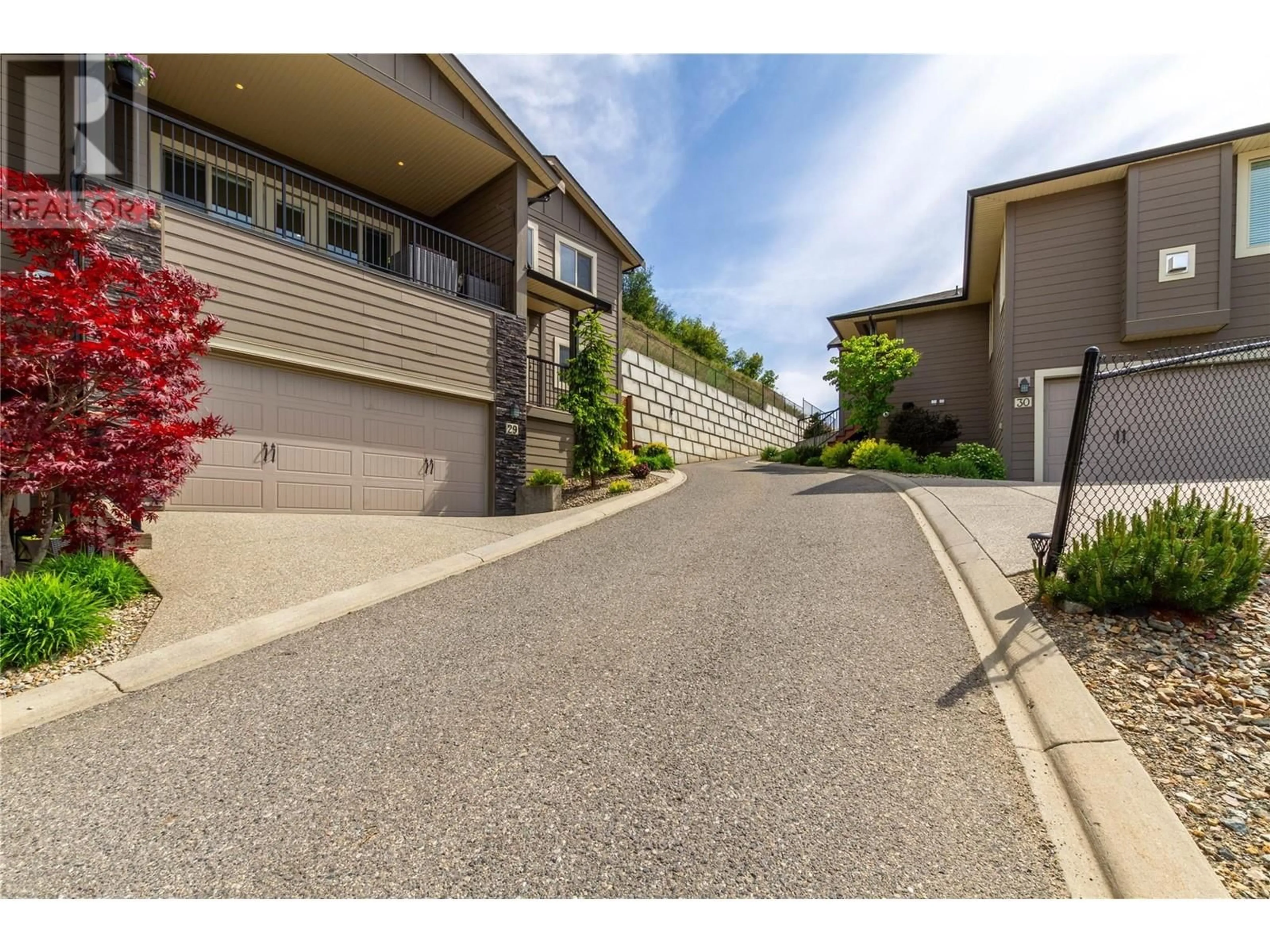 A pic from outside/outdoor area/front of a property/back of a property/a pic from drone, street for 29 - 1040 MT.REVELSTOKE PLACE, Vernon British Columbia V1B4E3