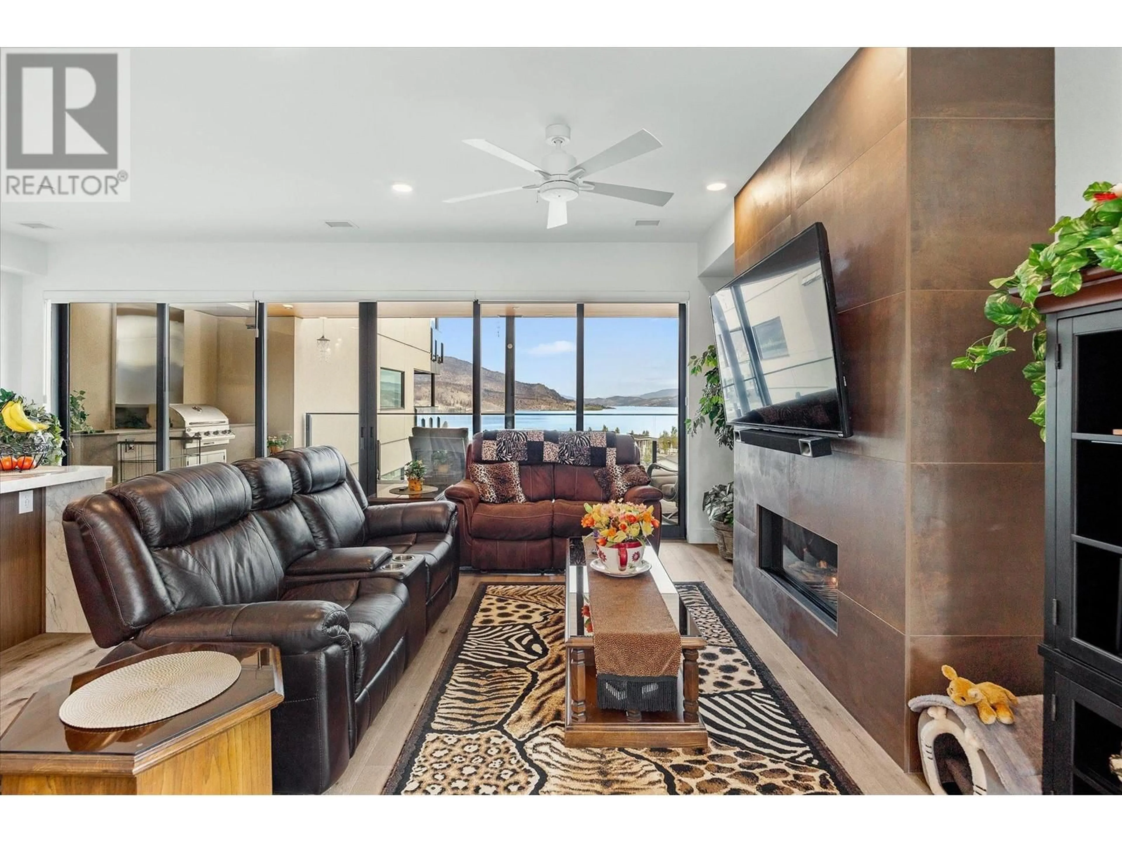 Living room with furniture, ceramic/tile floor for 3405 - 3000 ARIVA DRIVE, Kelowna British Columbia V1Z0B3