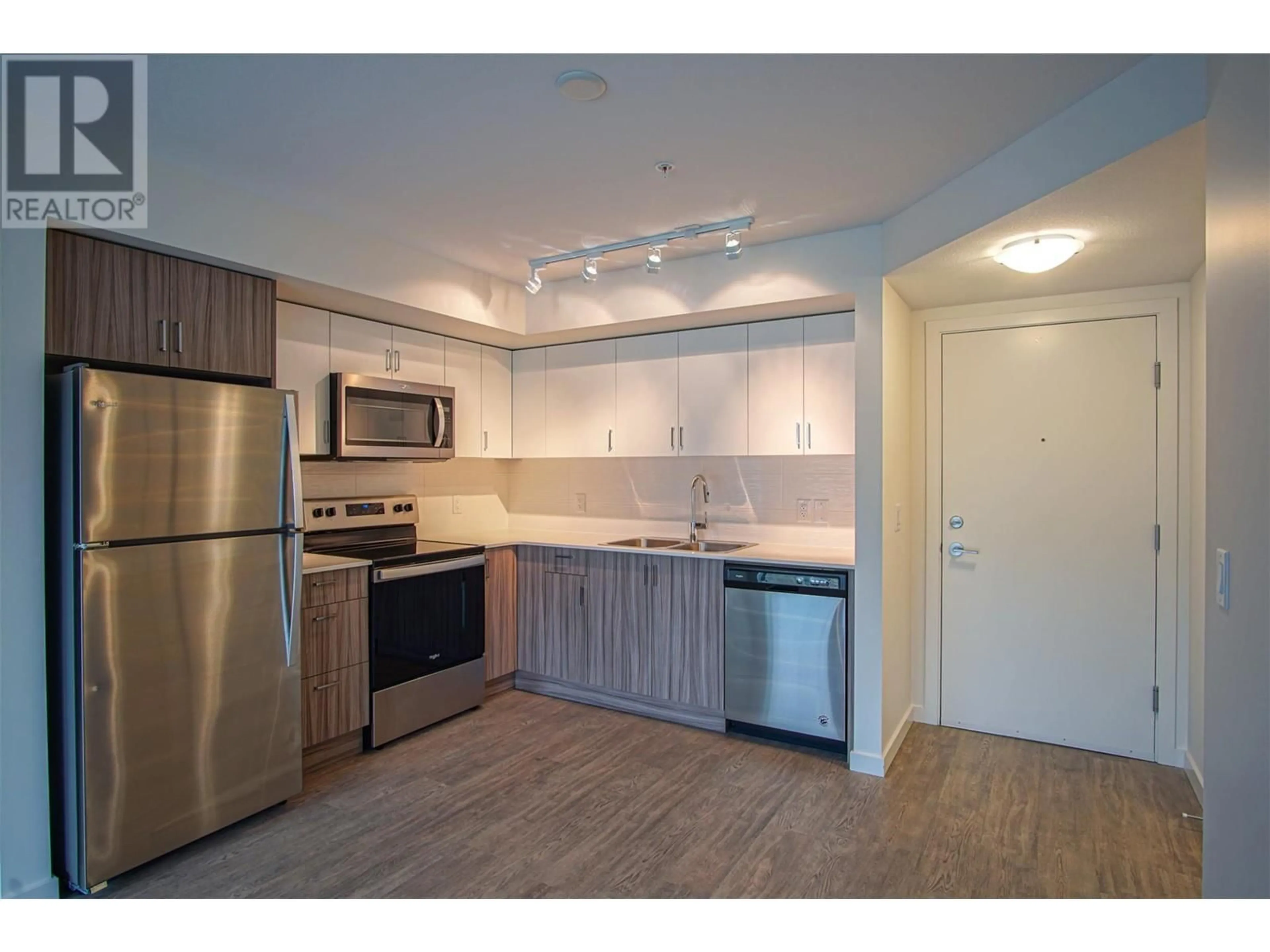 Standard kitchen, wood/laminate floor for 110 - 625 ACADEMY WAY, Kelowna British Columbia V1V3A4