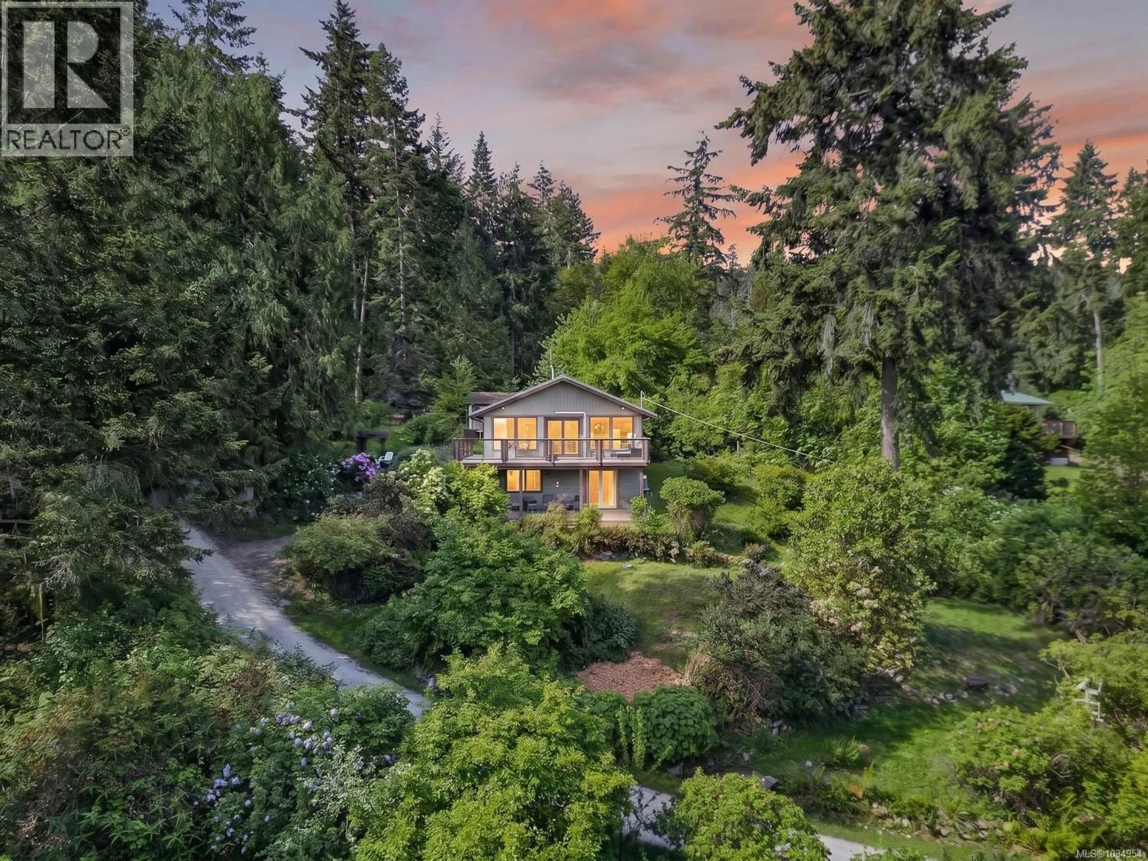 A pic from outside/outdoor area/front of a property/back of a property/a pic from drone, forest/trees view for 206 ROLAND ROAD, Salt Spring British Columbia V8K2B7