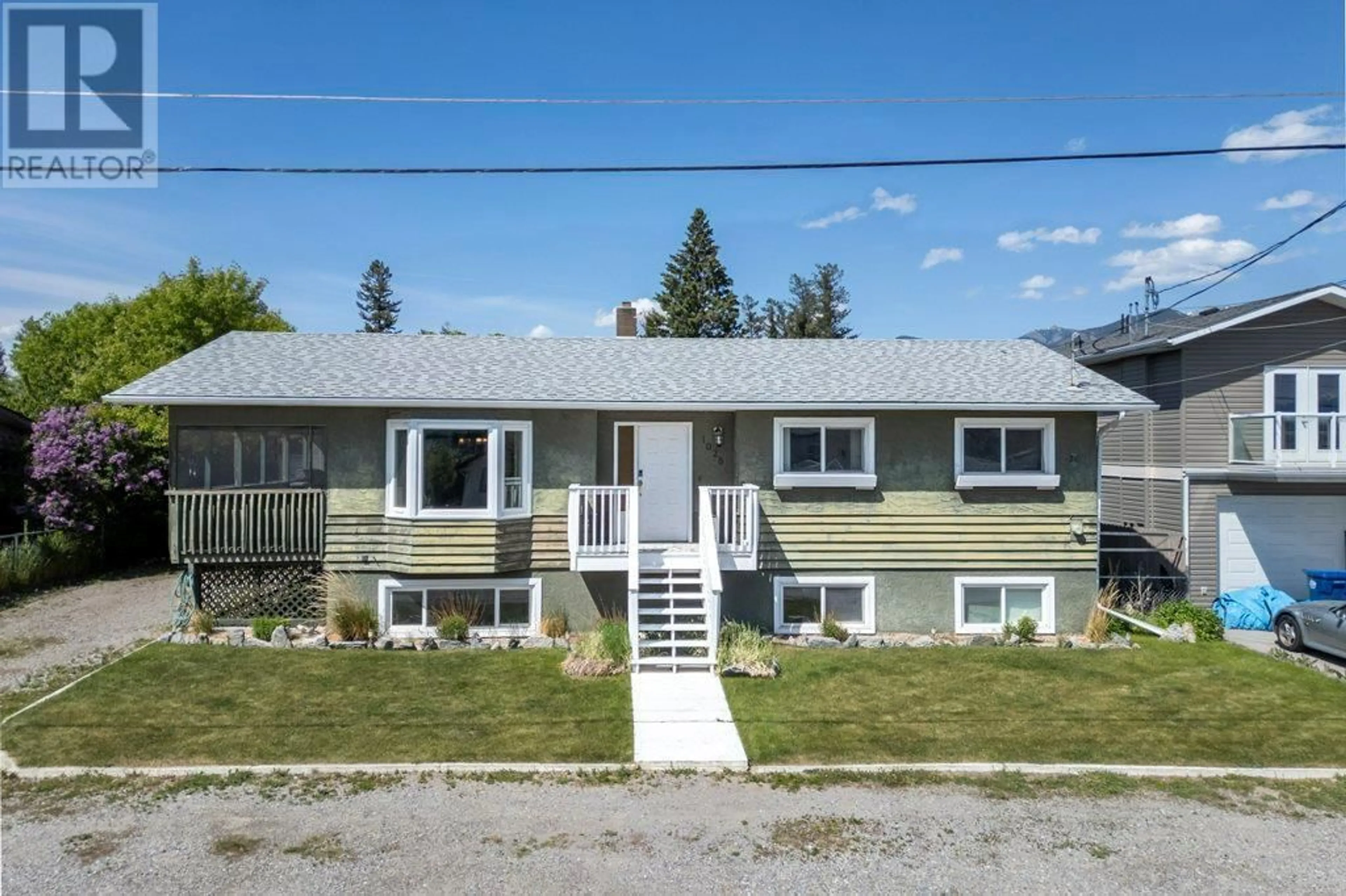 Home with vinyl exterior material, street for 1028 6 STREET, Invermere British Columbia V0A1K0