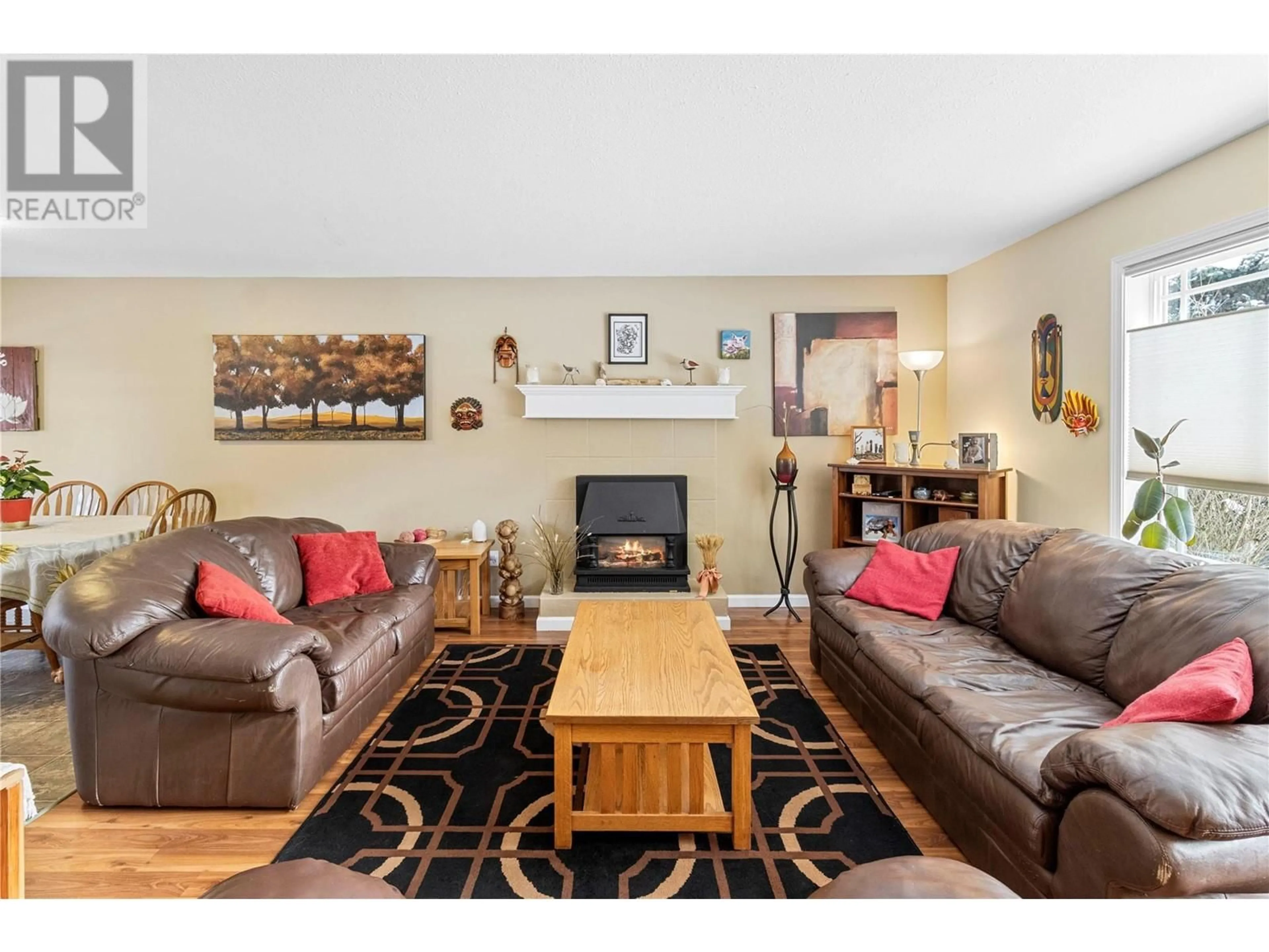 Living room with furniture, wood/laminate floor for 4651 71 AVENUE NORTHEAST, Salmon Arm British Columbia V0E1K0