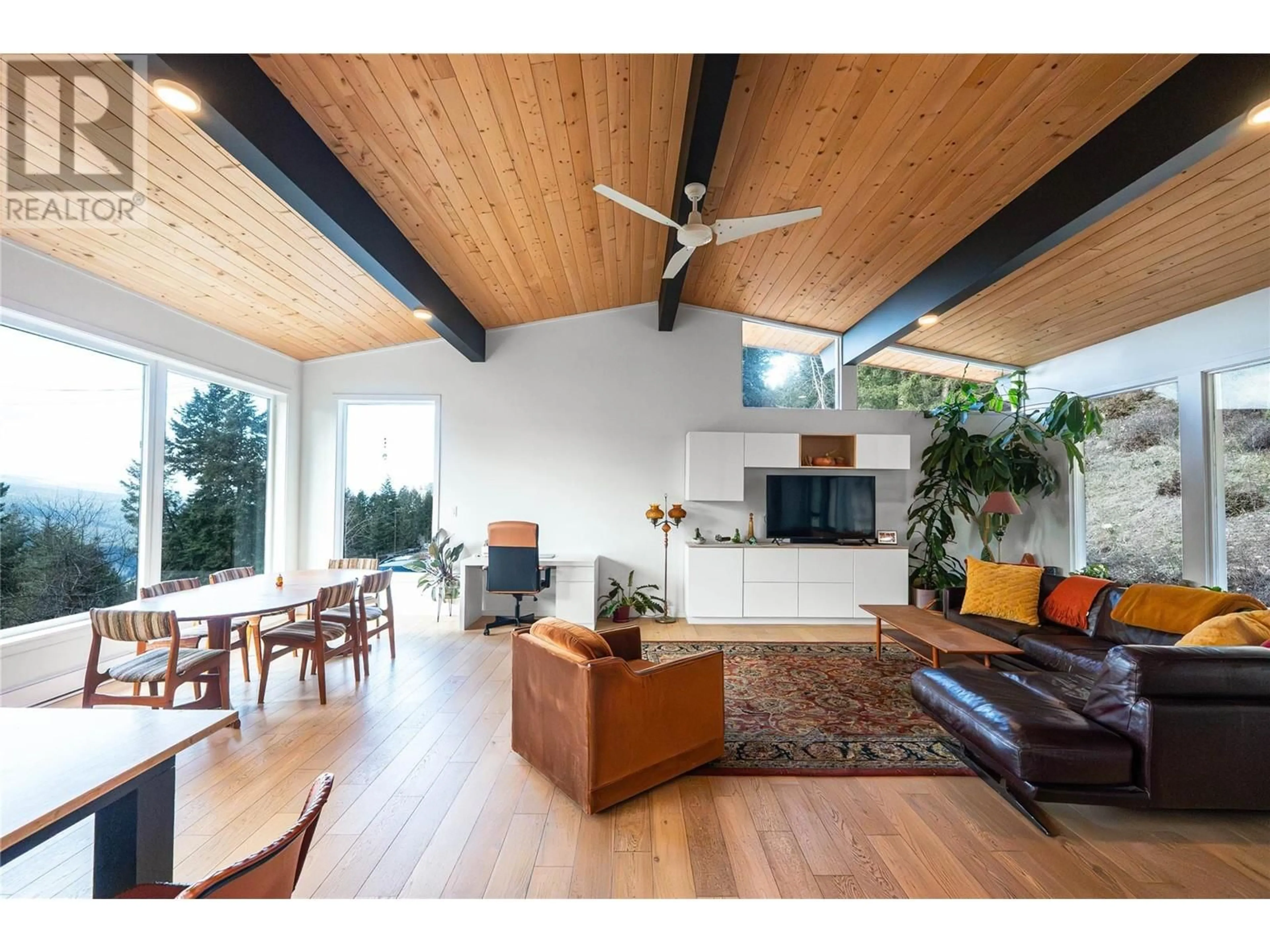 Living room with furniture, wood/laminate floor for 8250 SUN VALLEY ROAD, Joe Rich British Columbia V1P1J3