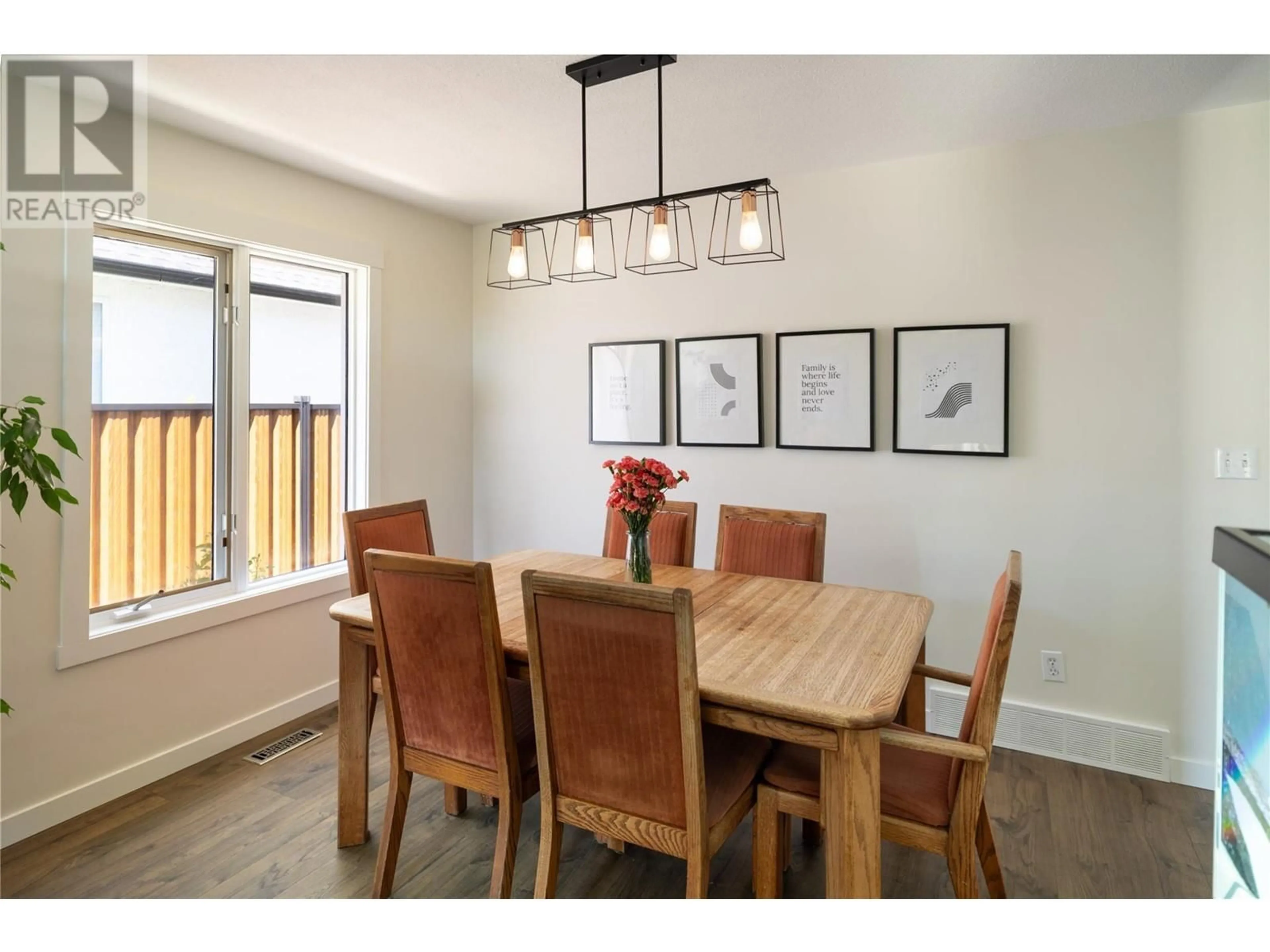 Dining room, wood/laminate floor for 1864 PORTLAND PLACE, Kelowna British Columbia V1V1P9